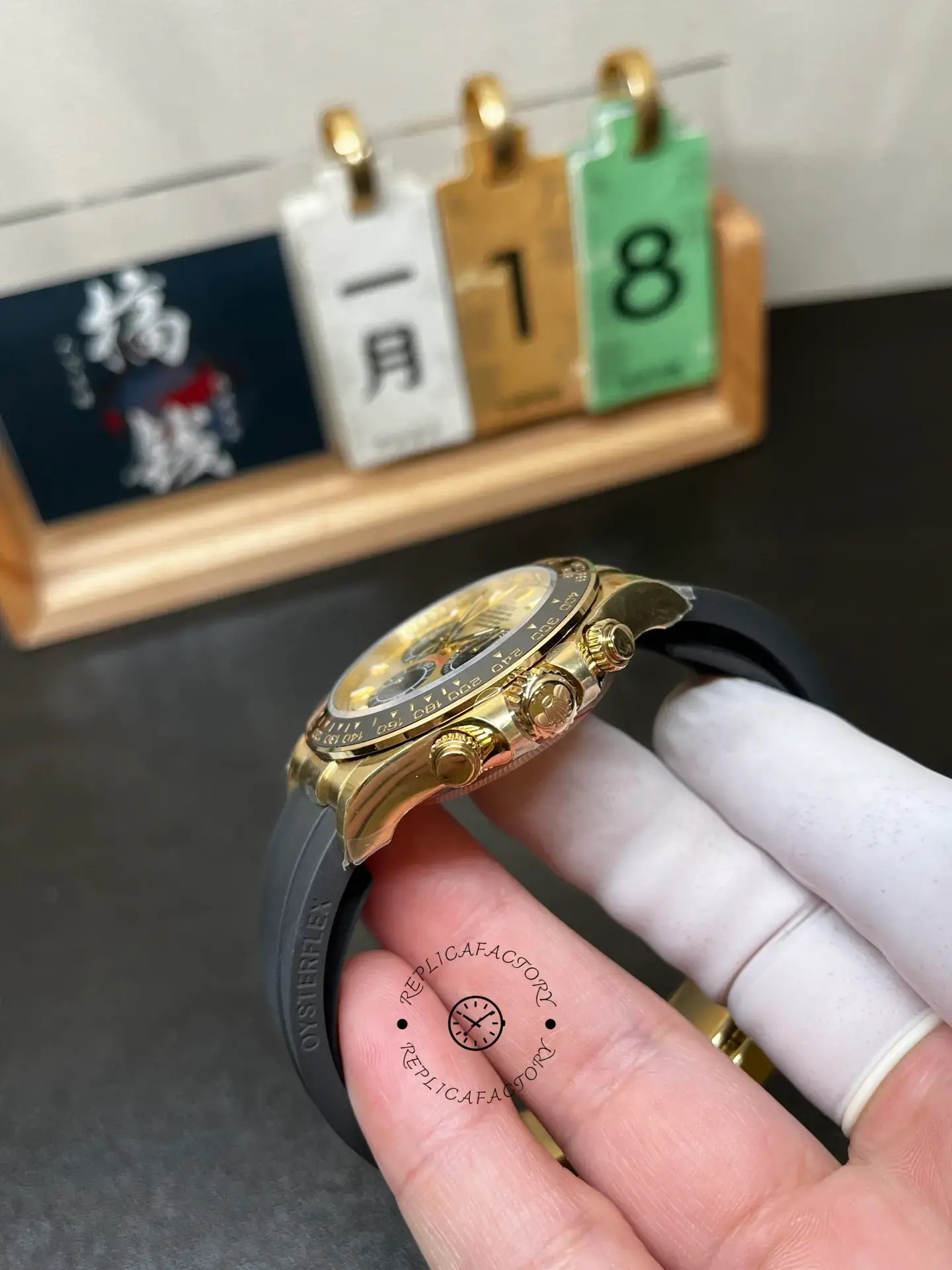 Side profile of Rolex Daytona 126518LN-0012 showing crown, pushers, and Oysterflex strap.