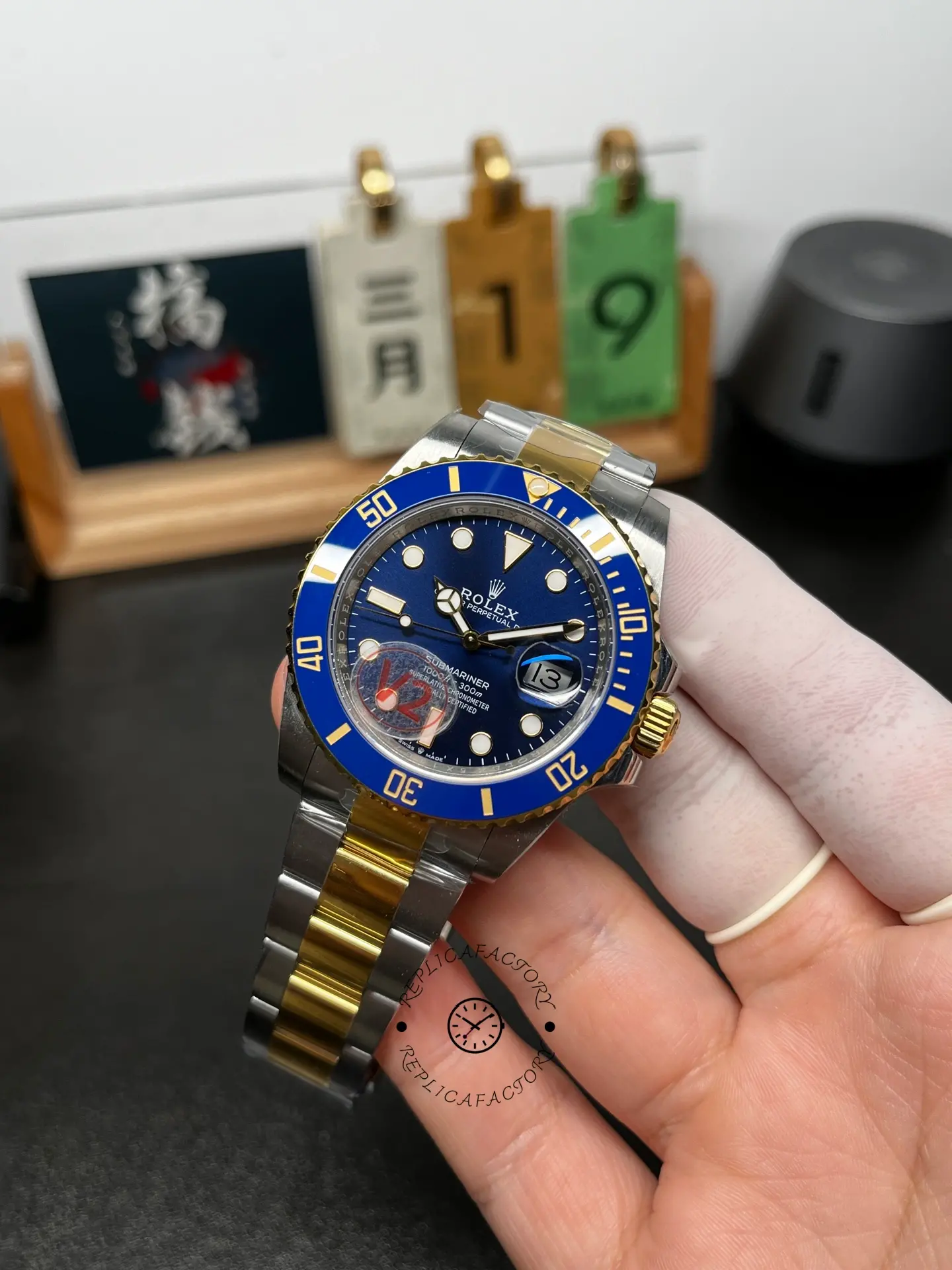 Angled front view of Rolex Submariner 126613LB showing the blue dial, blue bezel, and two-tone bracelet.