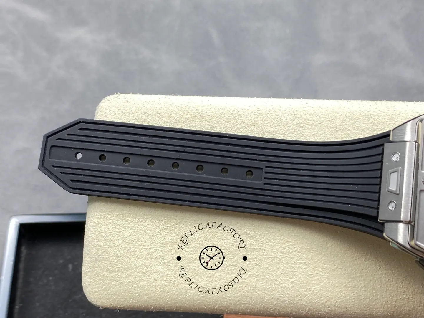 Strap detail of Hublot Spirit of Big Bang 642.NX.0170.RX showing black strap laid flat on pad.