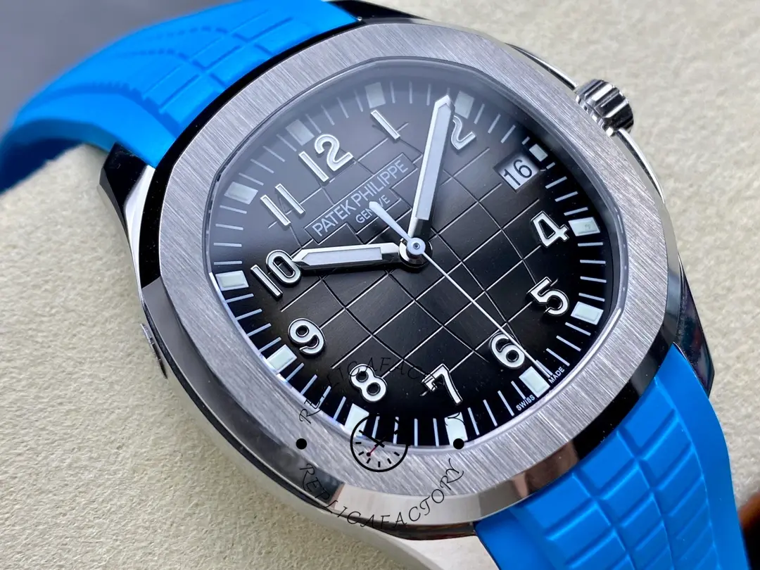 Front angle of Patek Philippe Aquanaut 5167A-001 showing polished bezel and blue strap grooves.