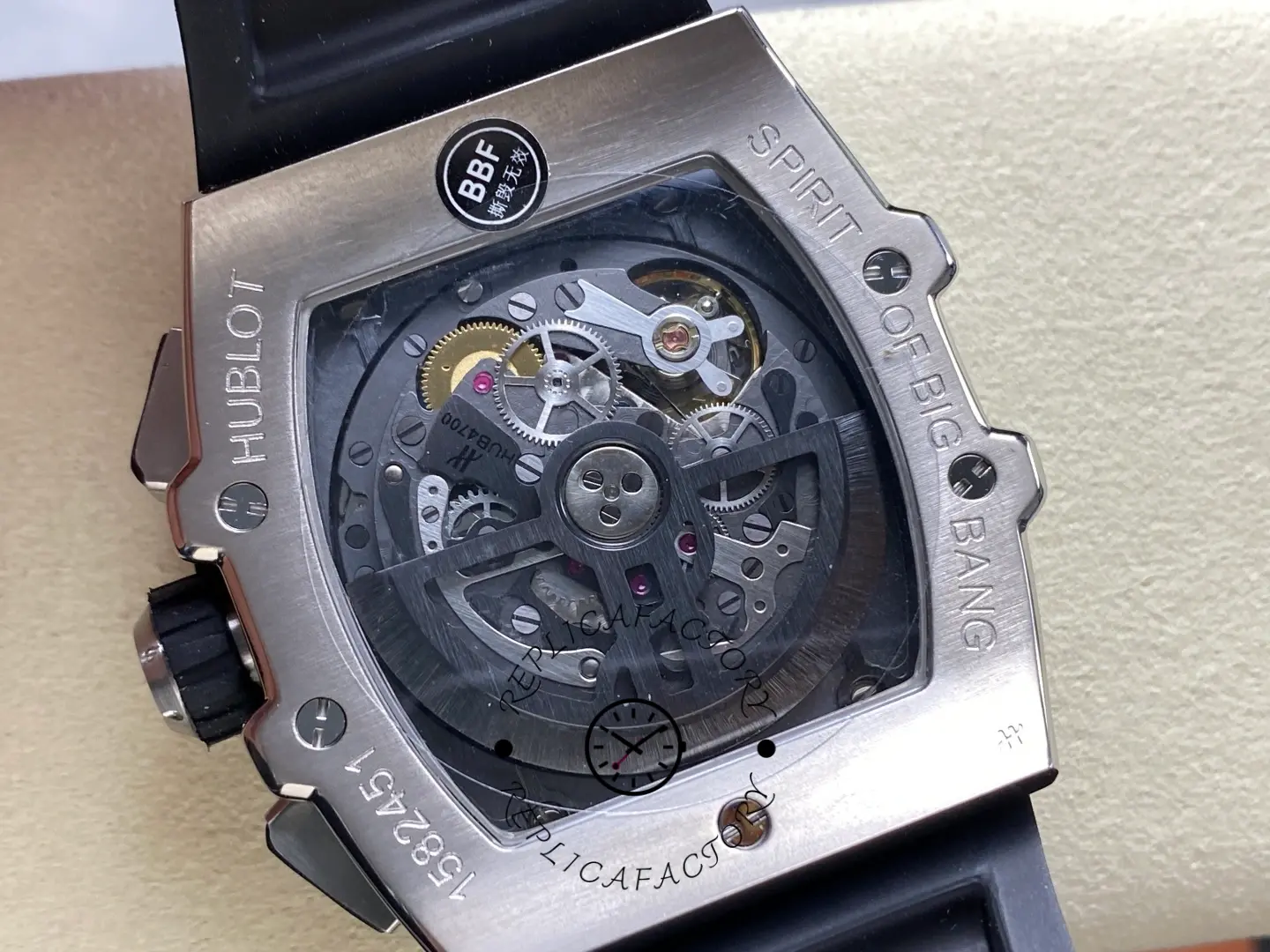 Caseback close-up of Hublot 642.NL.7170.RX highlighting rotor, screws, and exhibition window.