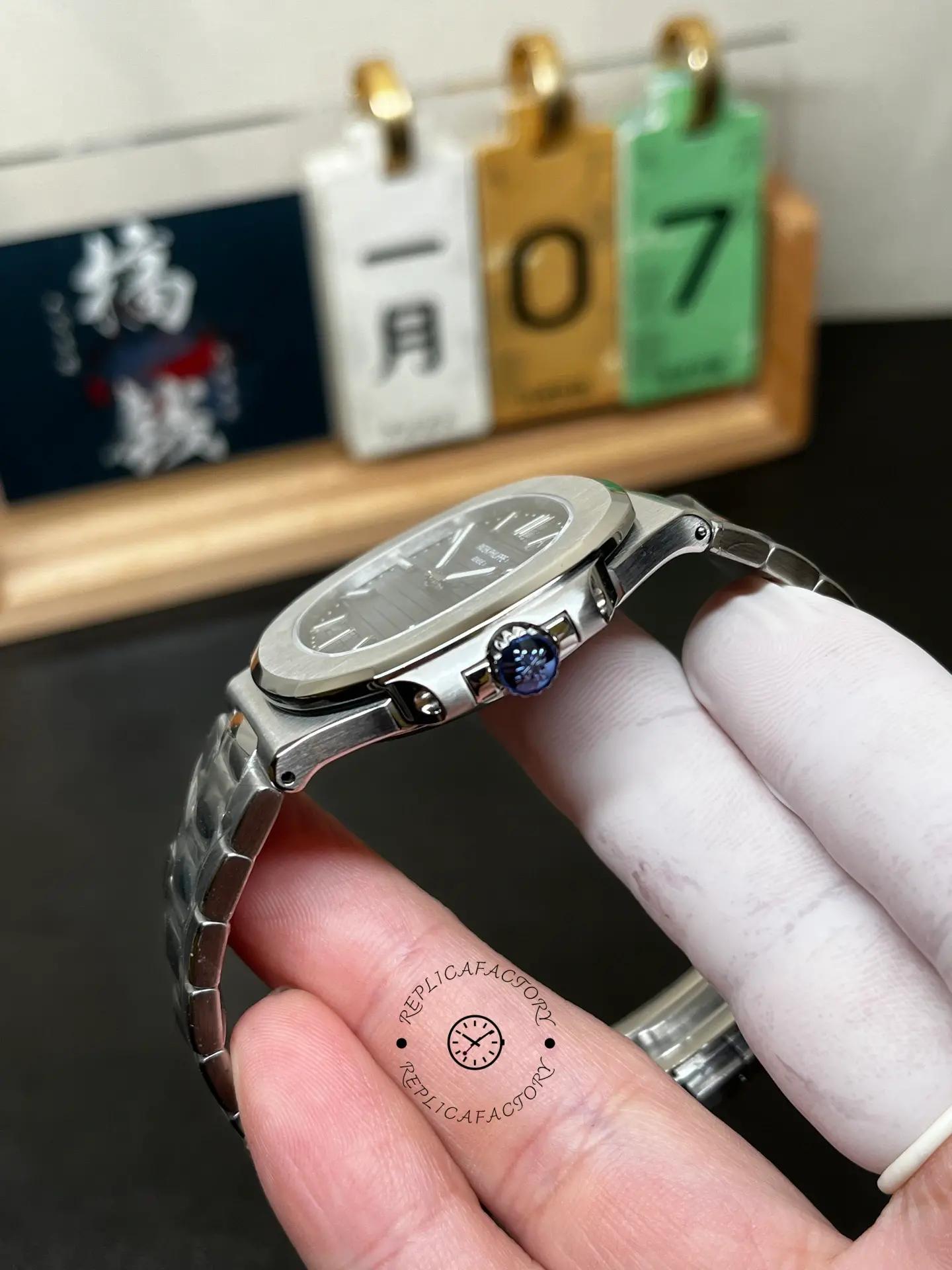 Side profile of Patek Philippe Nautilus 5711/1A showing slim case thickness and crown position.