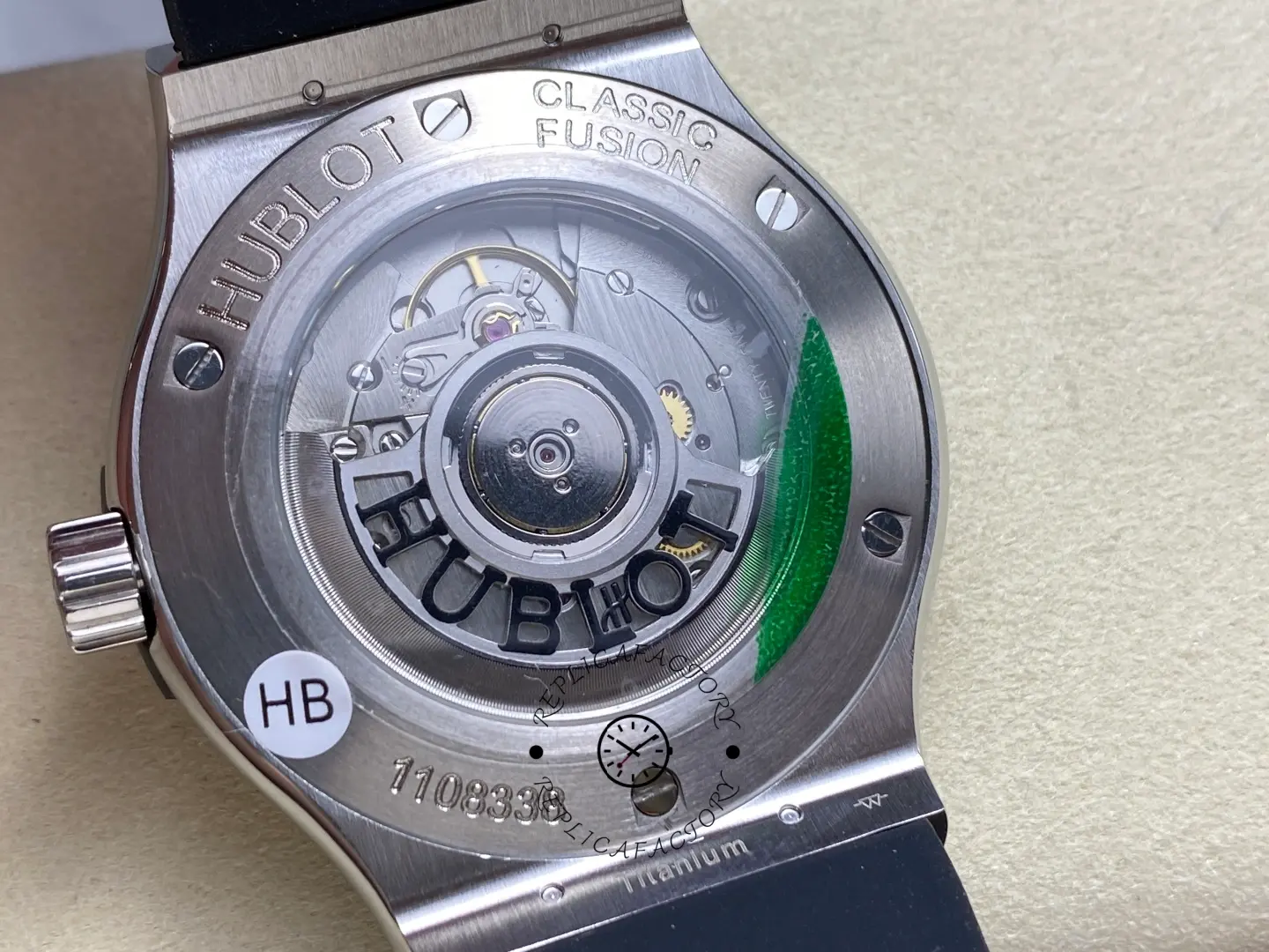 Exhibition caseback of Hublot 542.NX.1171.RX showing rotor with HUBLOT cutout and Classic Fusion engravings.