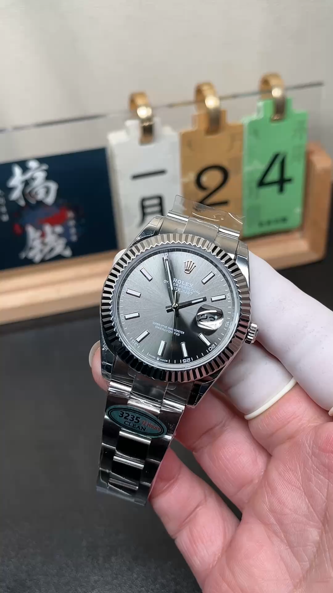 Video of Rolex Datejust M126334-0013 held in hand showing the slate dial and bracelet. - Video
