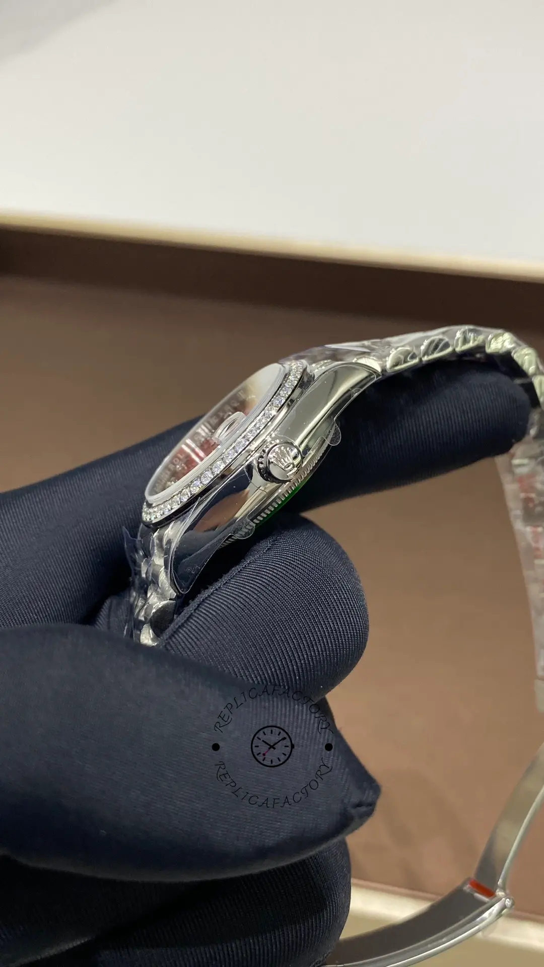 Side view of Rolex Datejust 31 278289RBR-0028 showing the diamond bezel, crown and polished white gold-style case.