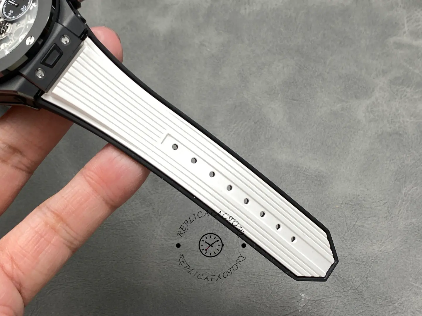 Strap holes detail of Hublot Big Bang Unico 441.CI.1171.RX showing ribbed white strap and perforations.