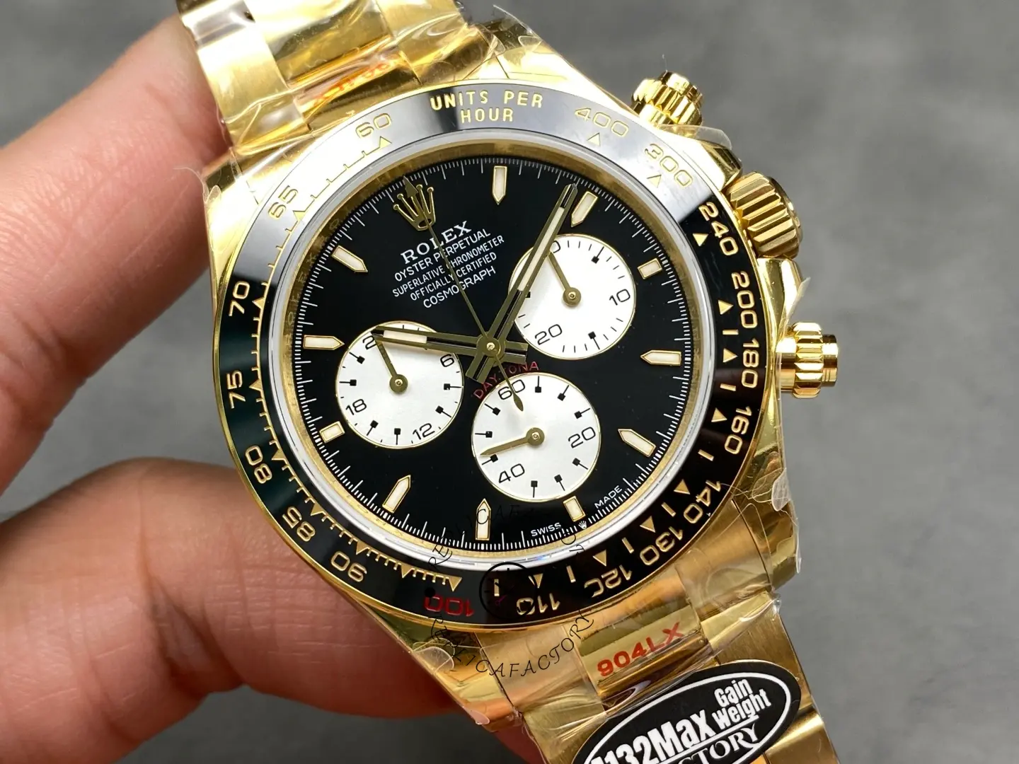 Front close-up of Rolex 126528LN Le Mans Daytona showing black dial, white subdials, and ceramic tachymeter bezel.