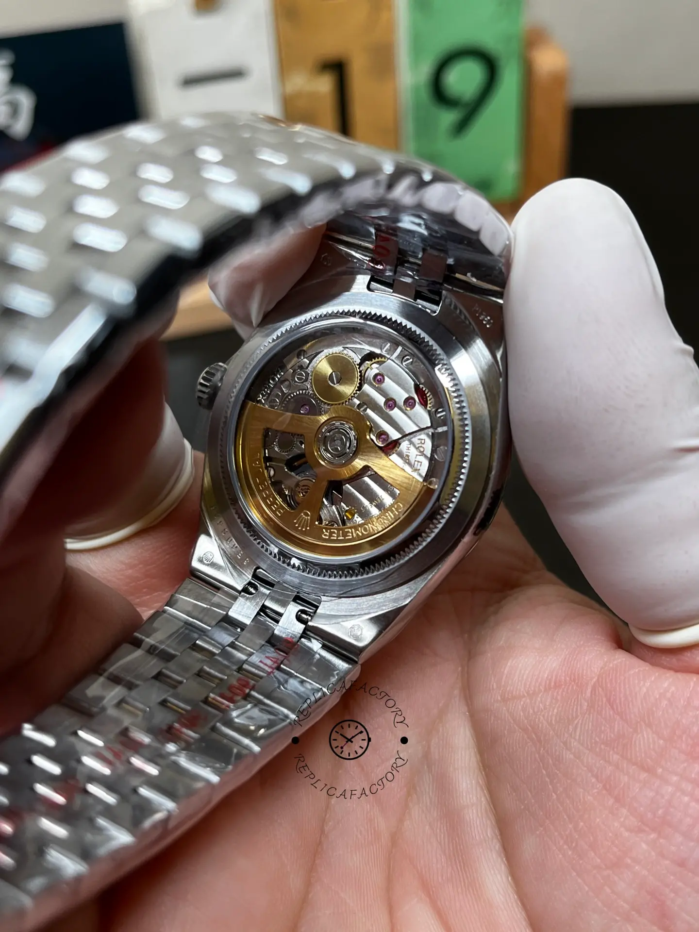 Back movement view of Rolex Land-Dweller 40 127336-0001 showing the exhibition-style case back and rotor.