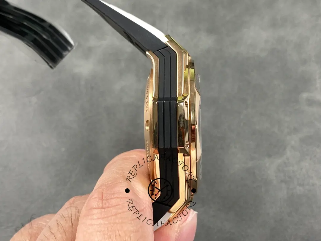 Side-in-hand view of Hublot 418.OX.2001.RX.MXM20 showing faceted bezel and case flank layers.