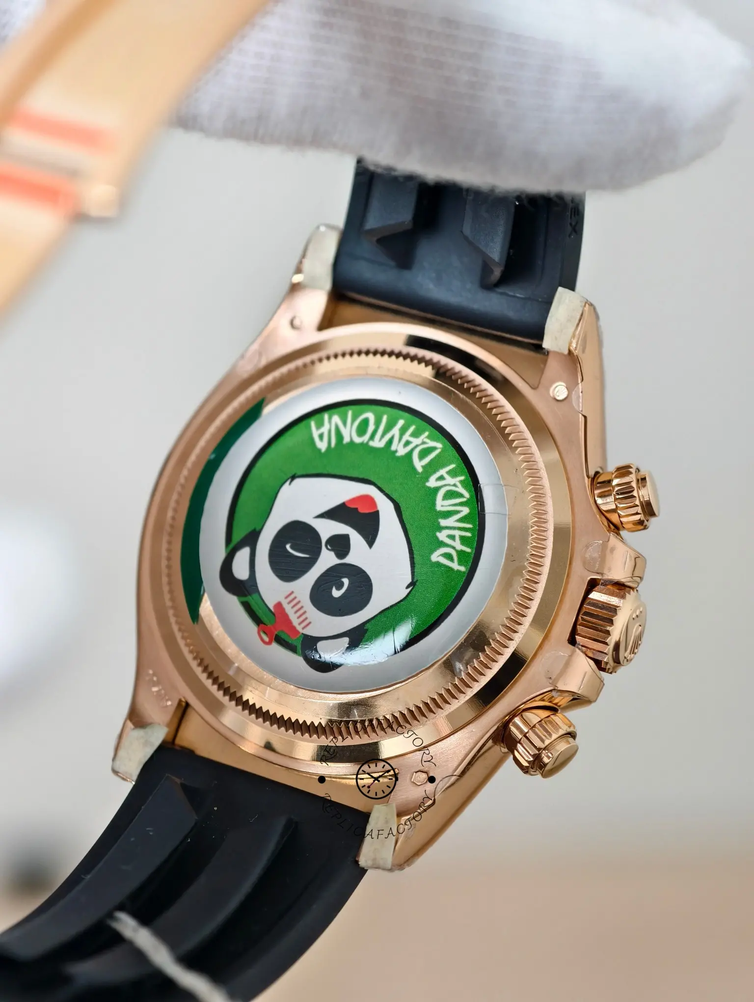 Caseback view of the Rolex Daytona 126515LN-0004 showing the rear cover and Everose chronograph pushers.