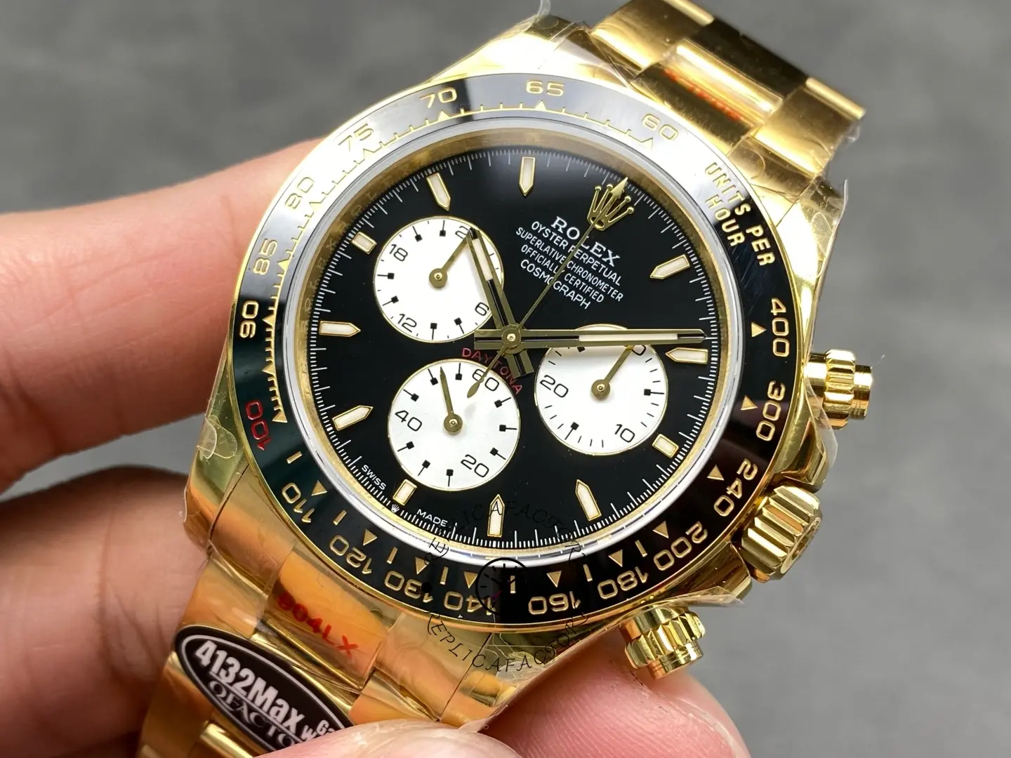 Angled close-up of Rolex 126528LN Le Mans Daytona highlighting bezel scale and black panda-style dial.