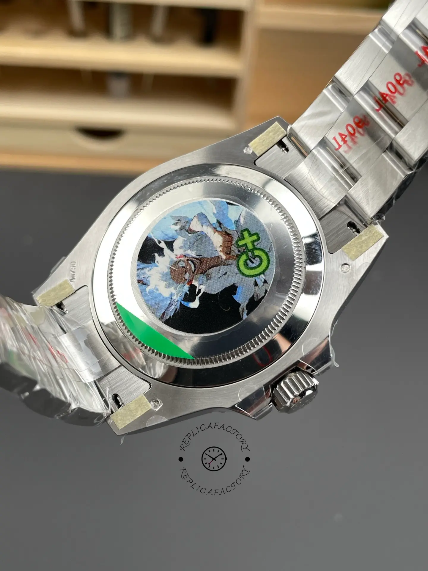 Caseback view of Rolex GMT-Master II 126719BLRO showing the solid back and rear Oyster bracelet links.