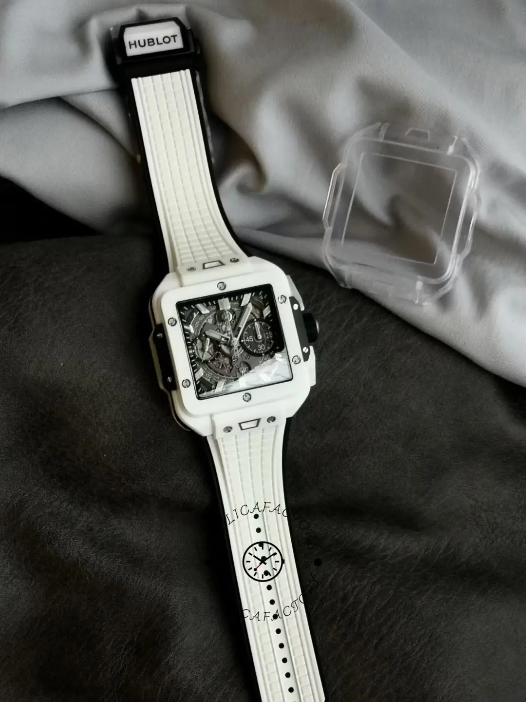 Full shot of Hublot Spirit of Big Bang 821.HX.0170.RX on fabric background, watch laid flat.