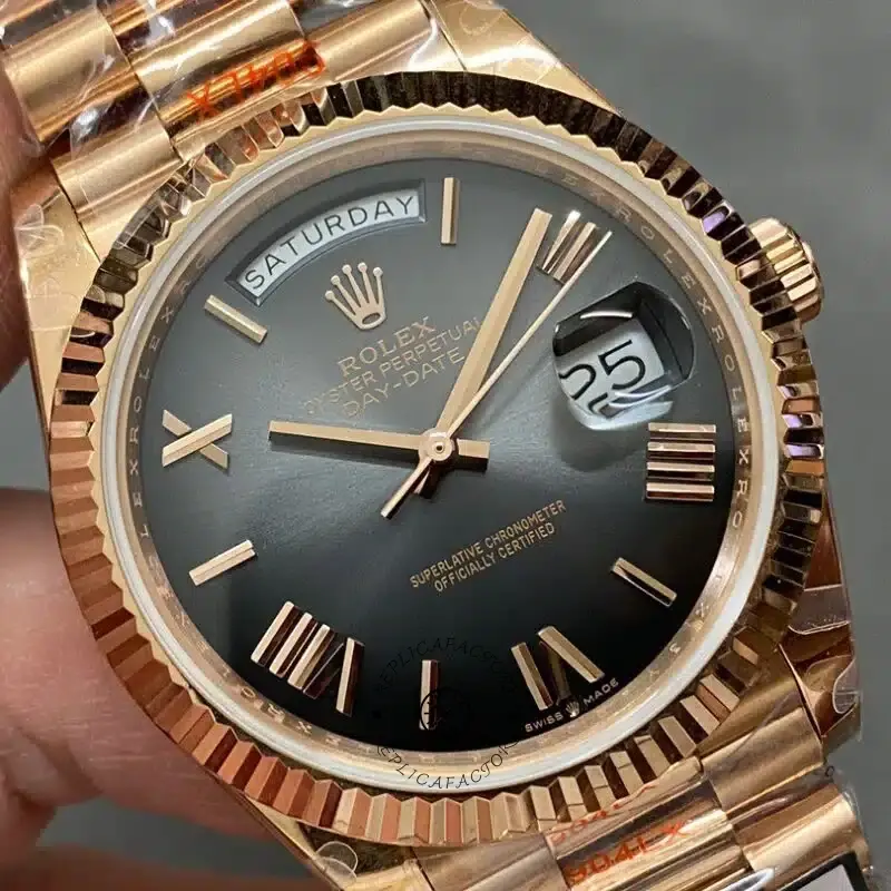 Dial close-up of Rolex Day-Date 40 M228235-0055 showing the dark sunburst dial and Everose fluted bezel.