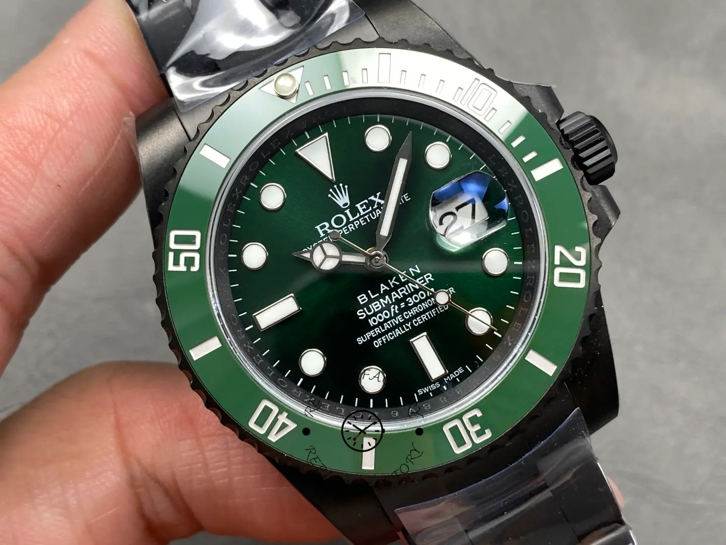 Another close-up of Rolex Submariner 116610LV showing green dial gradient and cyclops lens.