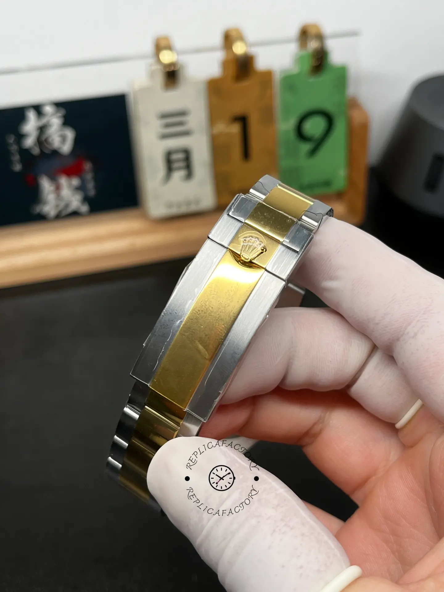 Clasp close-up of Rolex Submariner 126613LB showing the Oyster bracelet and crown logo on the clasp cover.