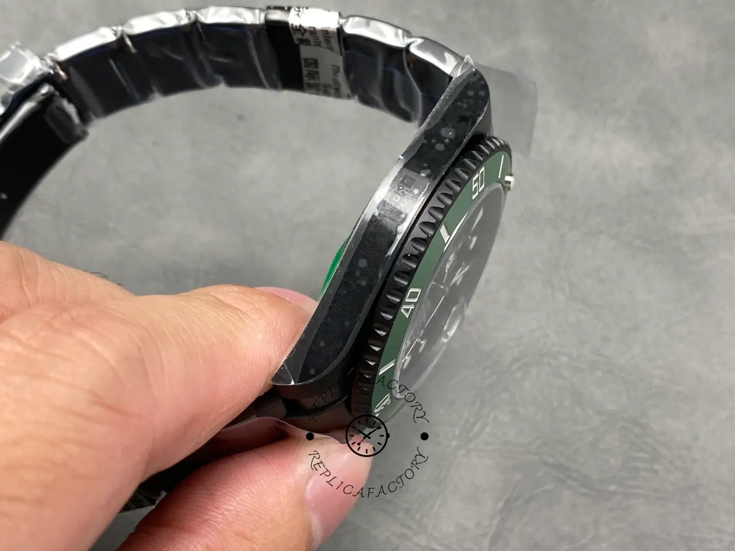 Side angle view of Rolex Submariner 116610LV showing black coated case and bezel teeth detail.