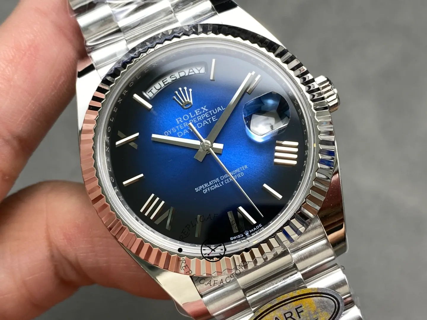 Rolex Day-Date 228239-0076 close-up of blue ombre dial with day window and date magnifier cyclops lens
