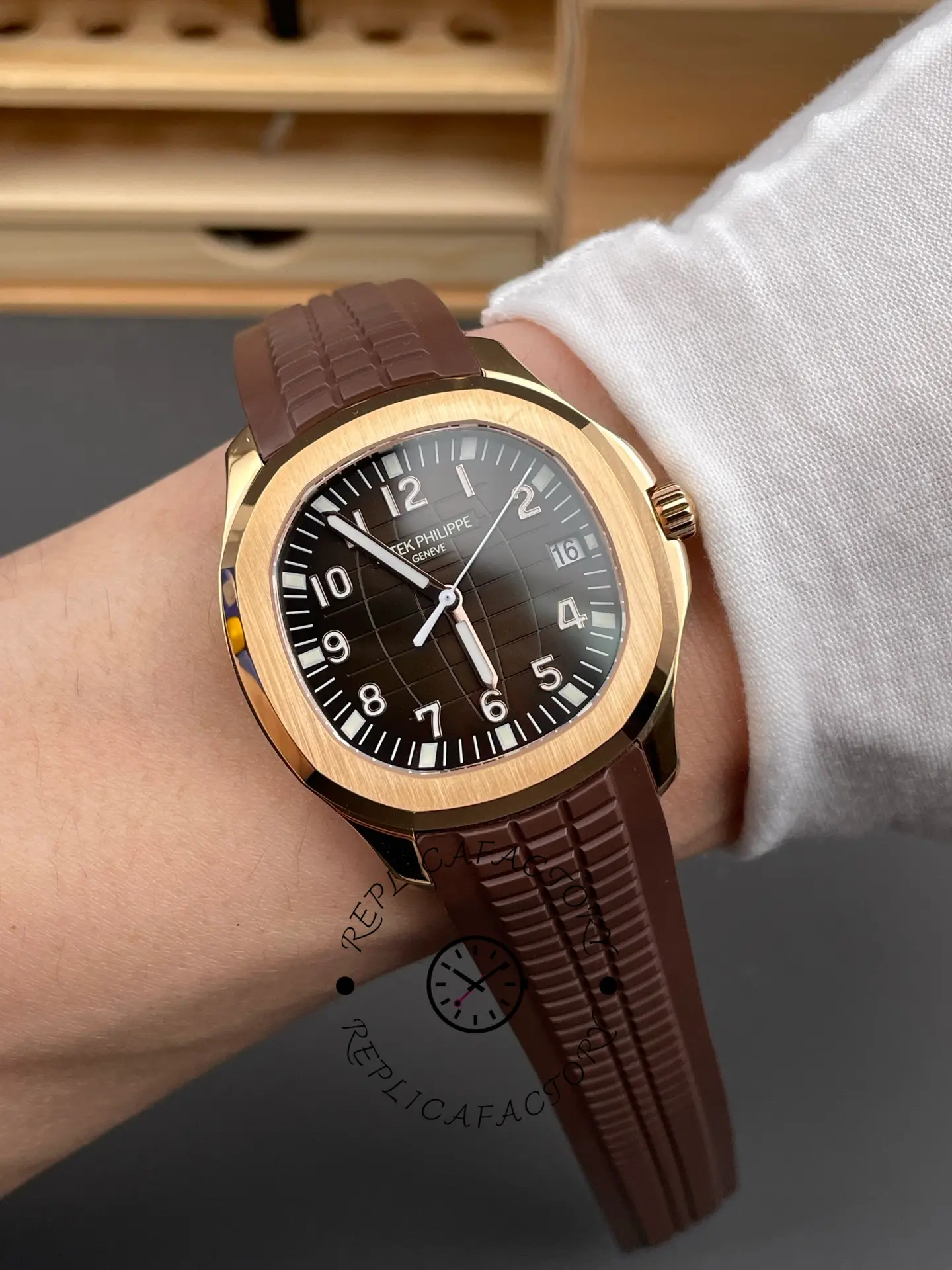 Patek Philippe Aquanaut 5167R-001 wrist shot showing brown dial rose gold case on rubber strap