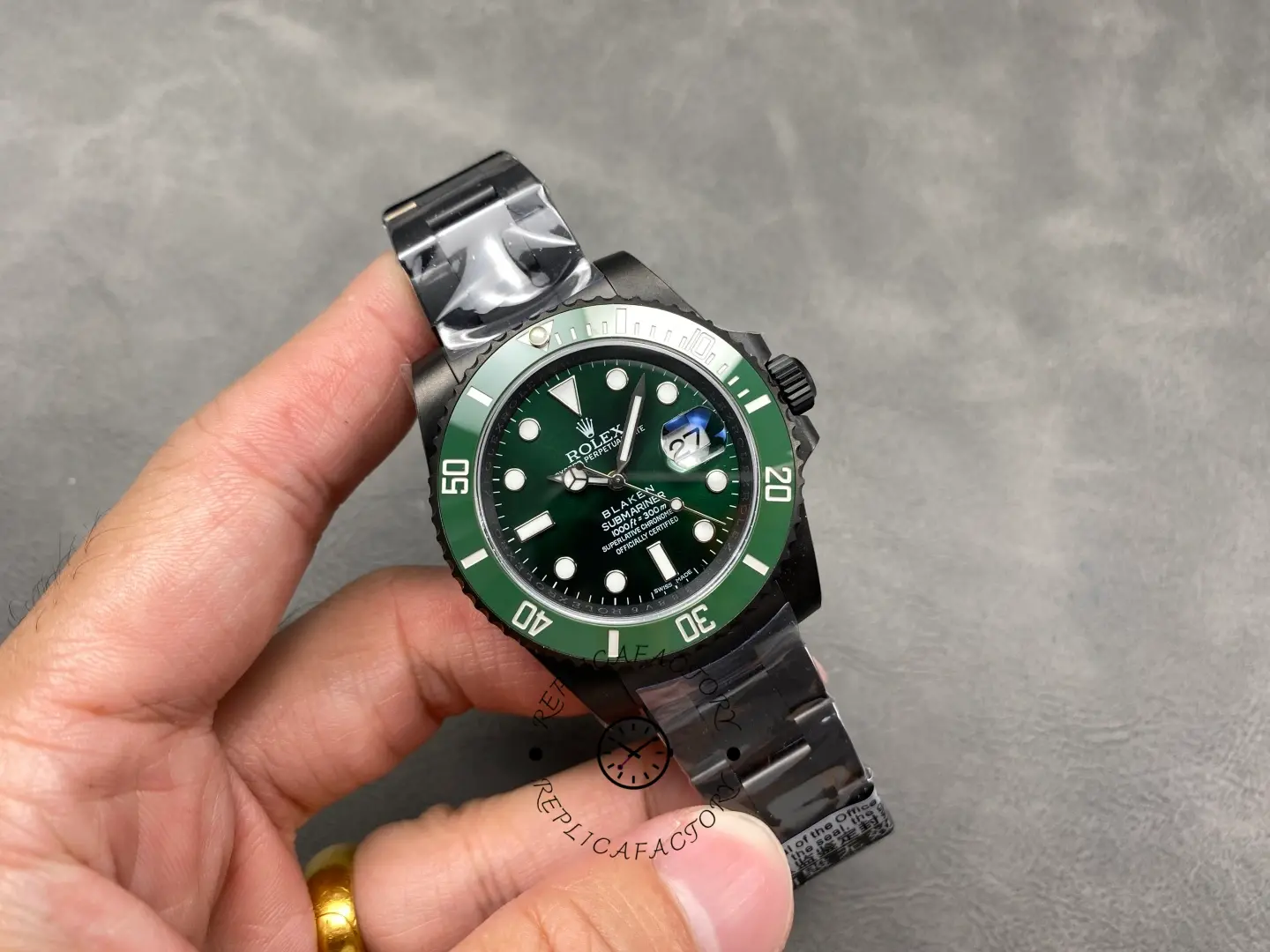 Hand-held angle shot of Rolex Submariner 116610LV showing dial and bezel contrast.