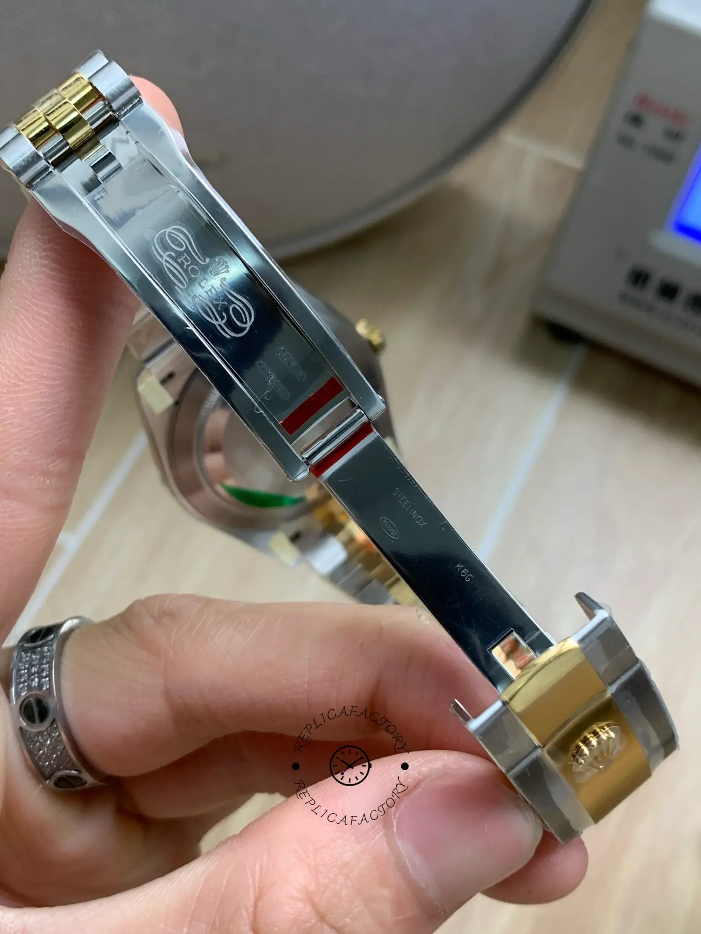 Open clasp detail of Rolex Datejust 41 126303-0010 showing inner clasp engraving and two-tone links.