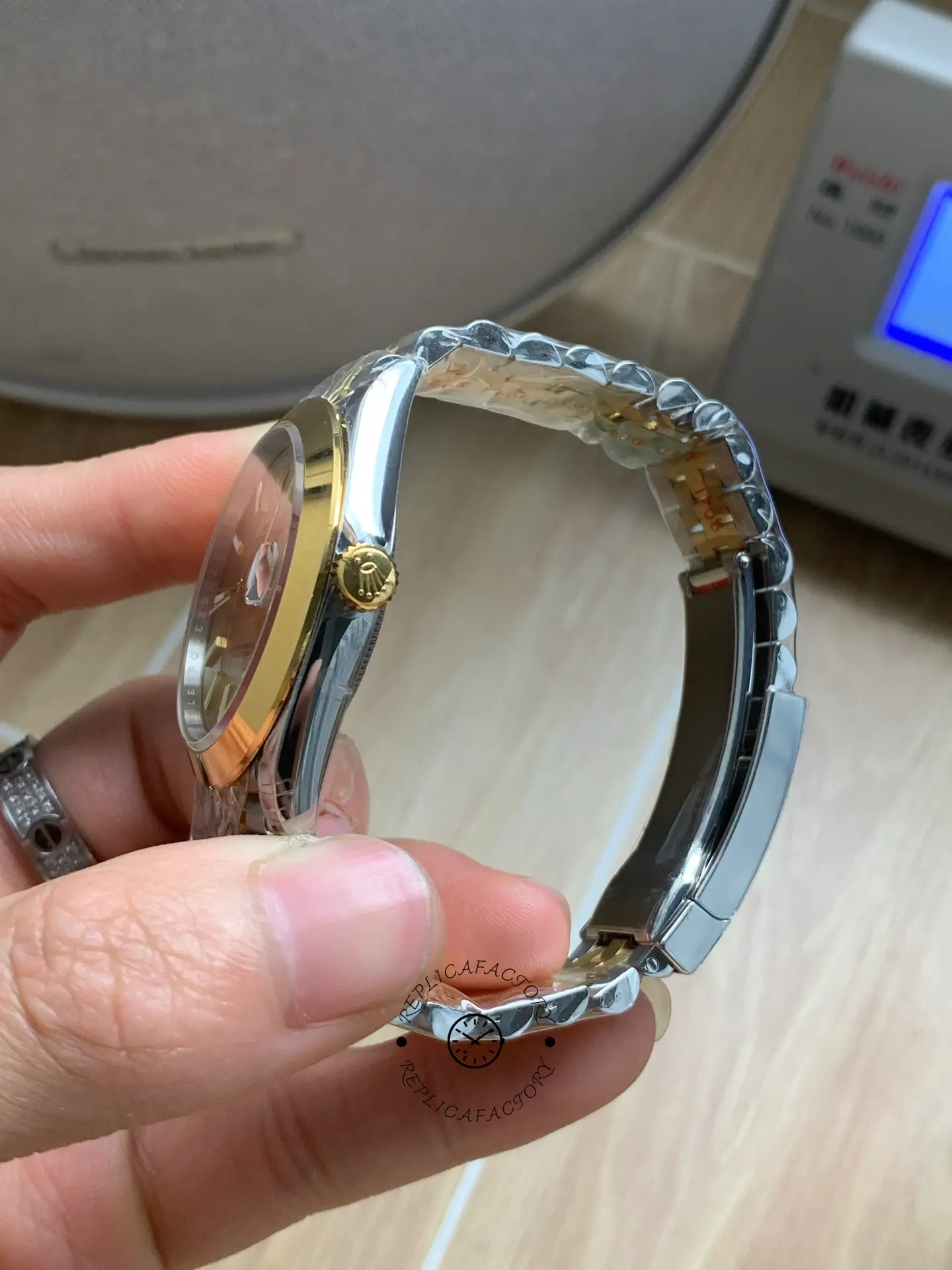 Side profile of Rolex Datejust 41 126303-0010 showing crown, case side, and bracelet curvature.