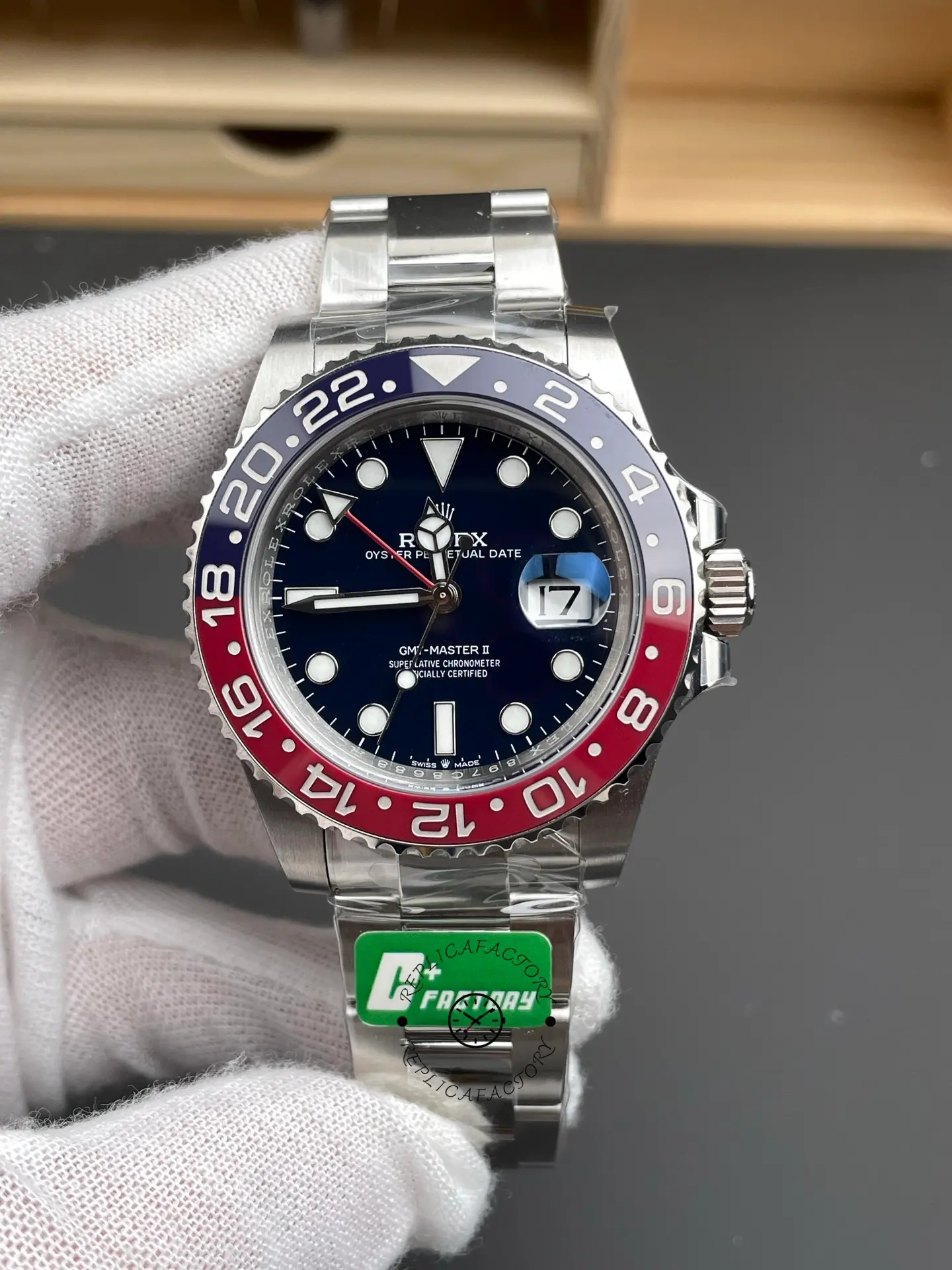 Front view of Rolex GMT-Master II 126719BLRO showing blue dial, Pepsi bezel, and magnified date window.