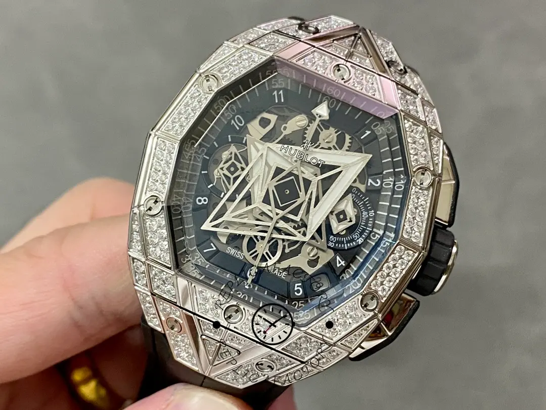 Close-up of Hublot 648.NX.0107.RX.1604.MXM23 showing geometric dial motif, subdials, and date window near 4–5 o’clock.