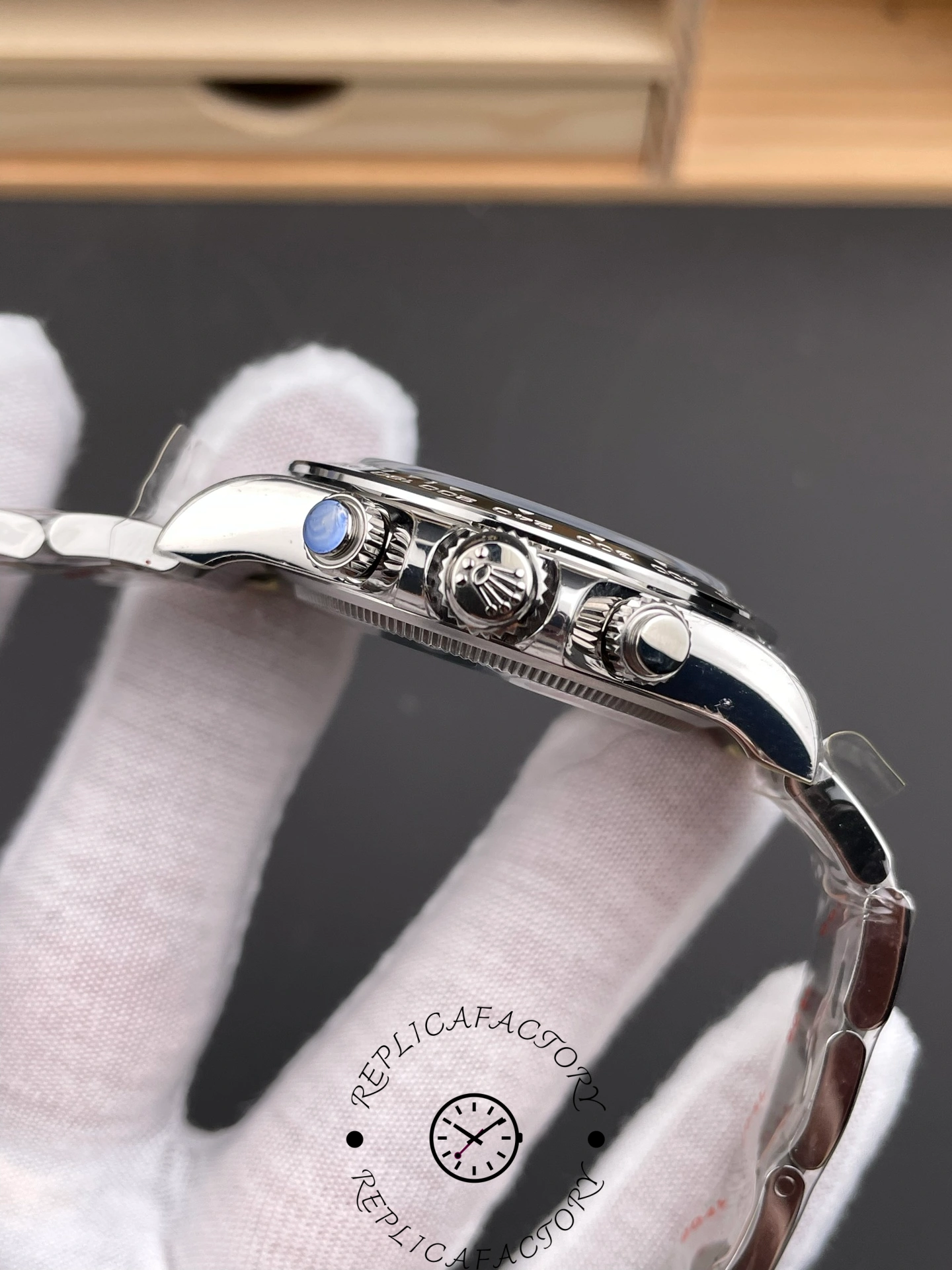 Side profile of Rolex Cosmograph Daytona m126500LN-0002 with crown and chronograph pushers.