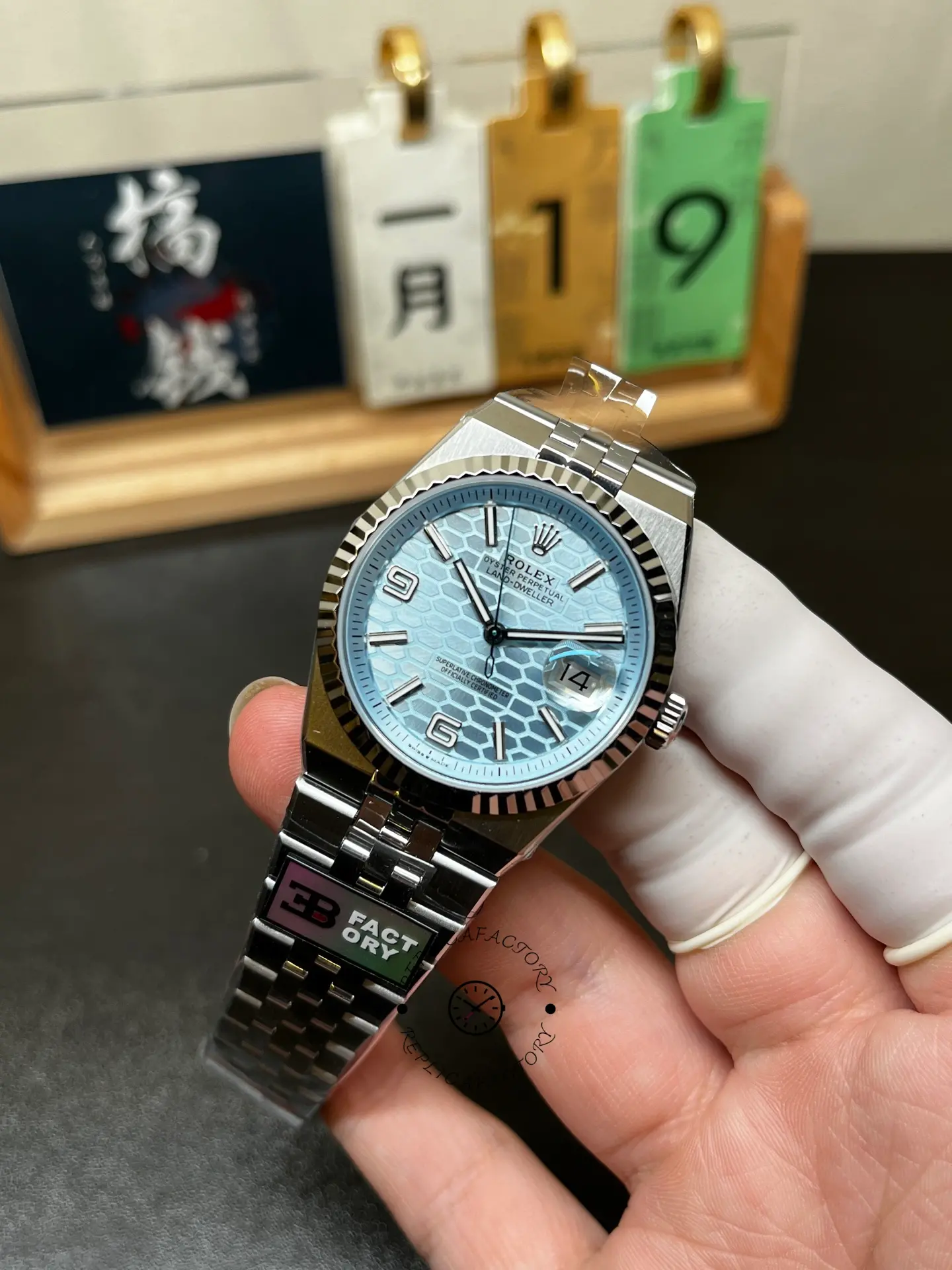 Angled front view of Rolex Land-Dweller 40 127336-0001 with ice blue dial and integrated steel bracelet.