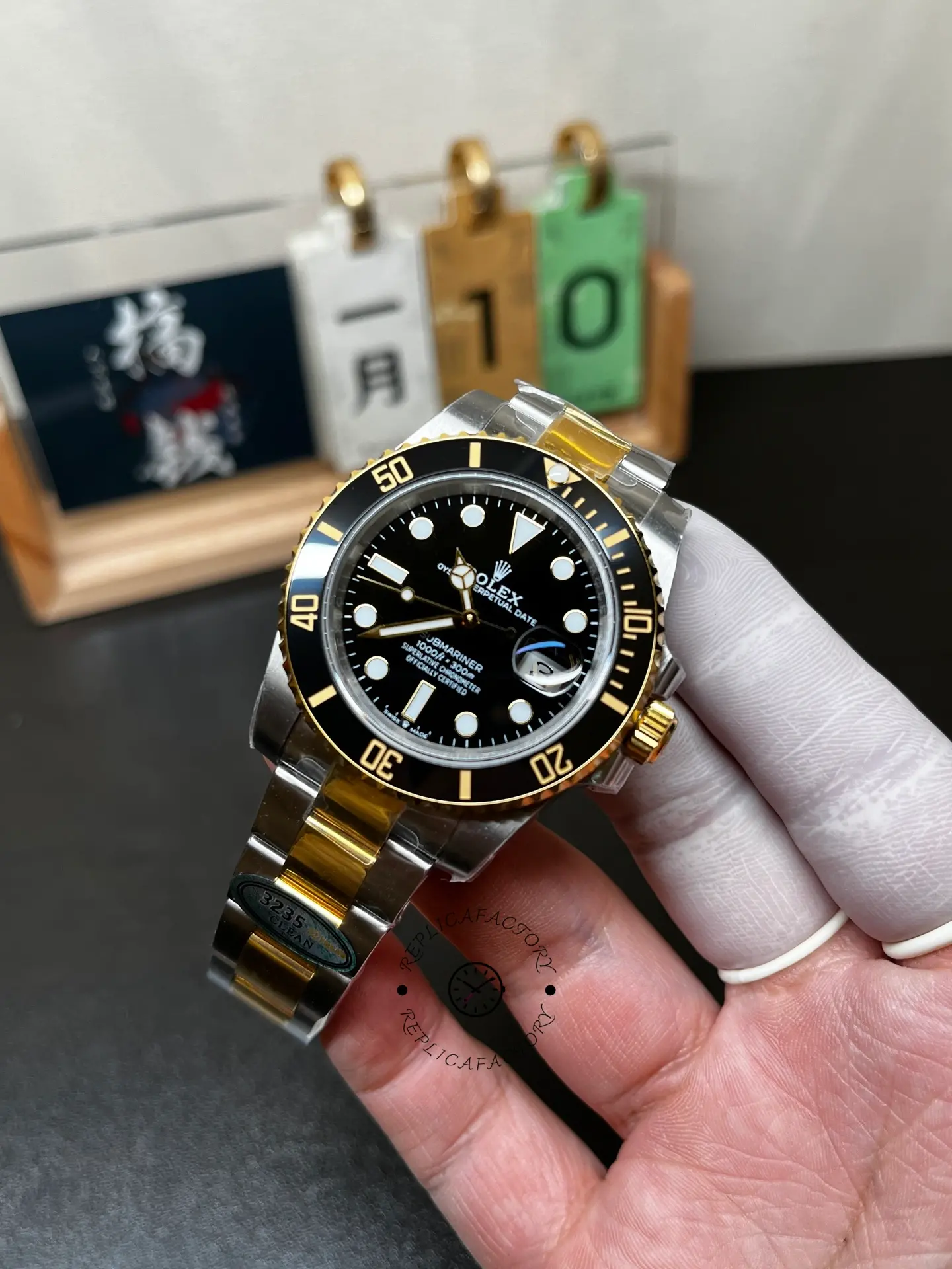 Angled front view of Rolex Submariner 126613LN-0002 replica with black dial, black bezel and gold crown.