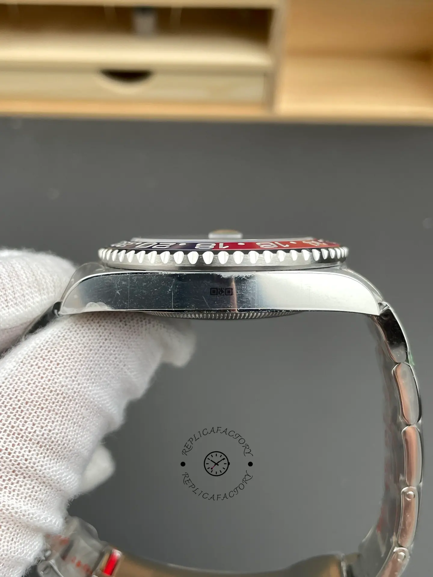 Left side profile of Rolex GMT-Master II 126719BLRO showing the slim case side and bezel edge.