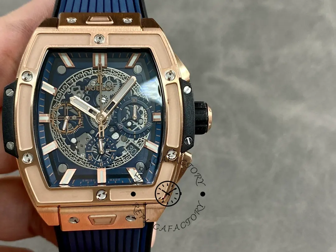 Handheld front view of Hublot Spirit of Big Bang 642.OX.7180.RX showing rose gold case and blue dial.