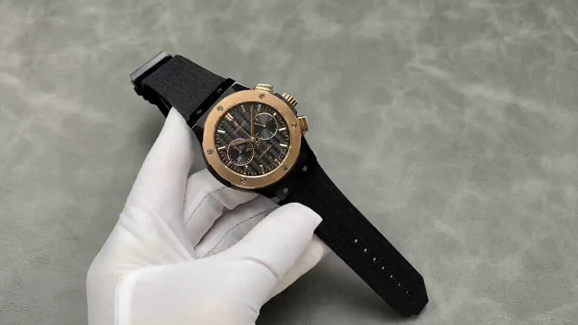 Strap in hand: Hublot Classic Fusion 521.CO.1781.RX showing black rubber strap laid out. - Video
