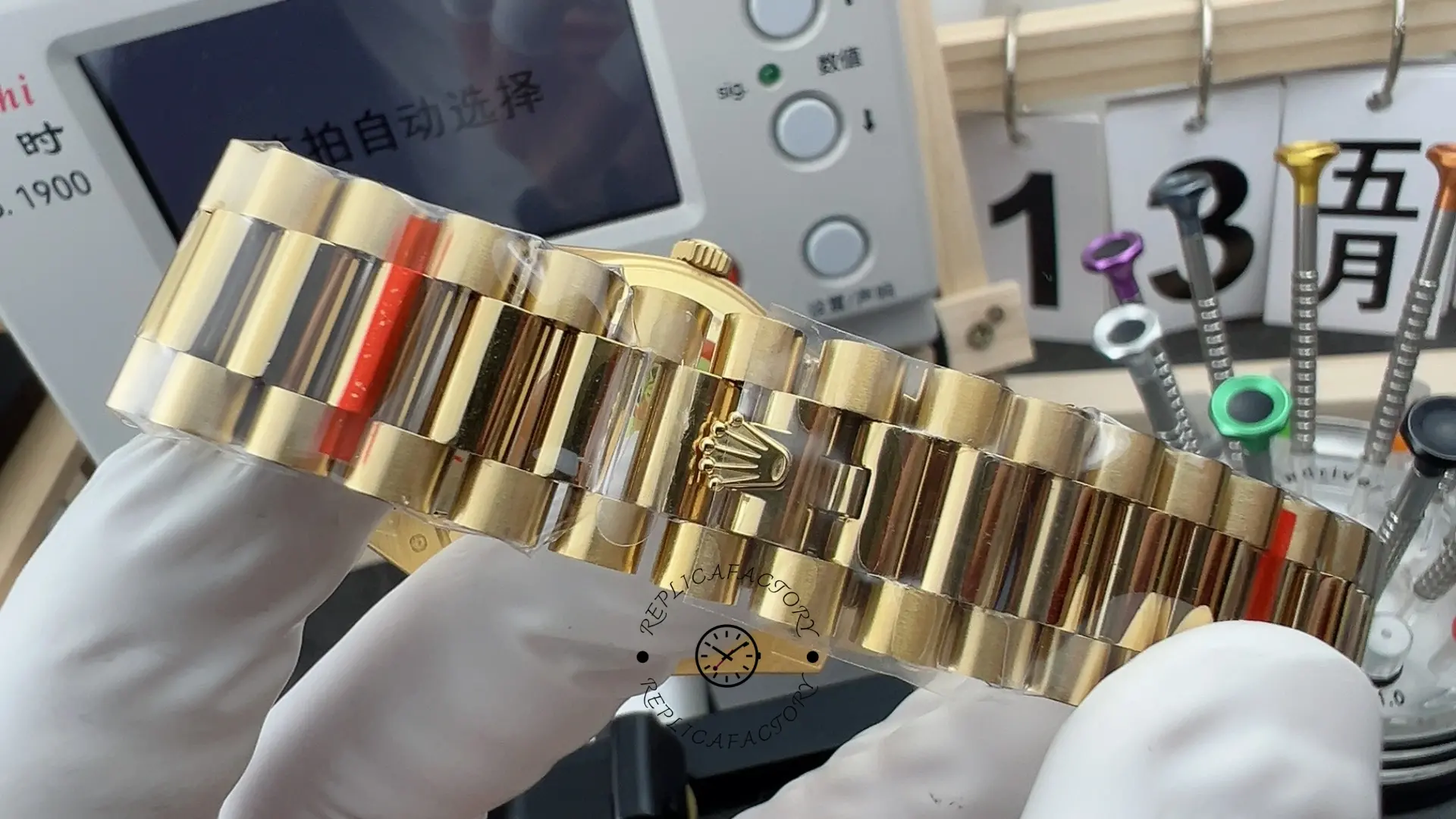 Bracelet exterior of Rolex Day-Date 228238 showing polished center links and crown clasp.