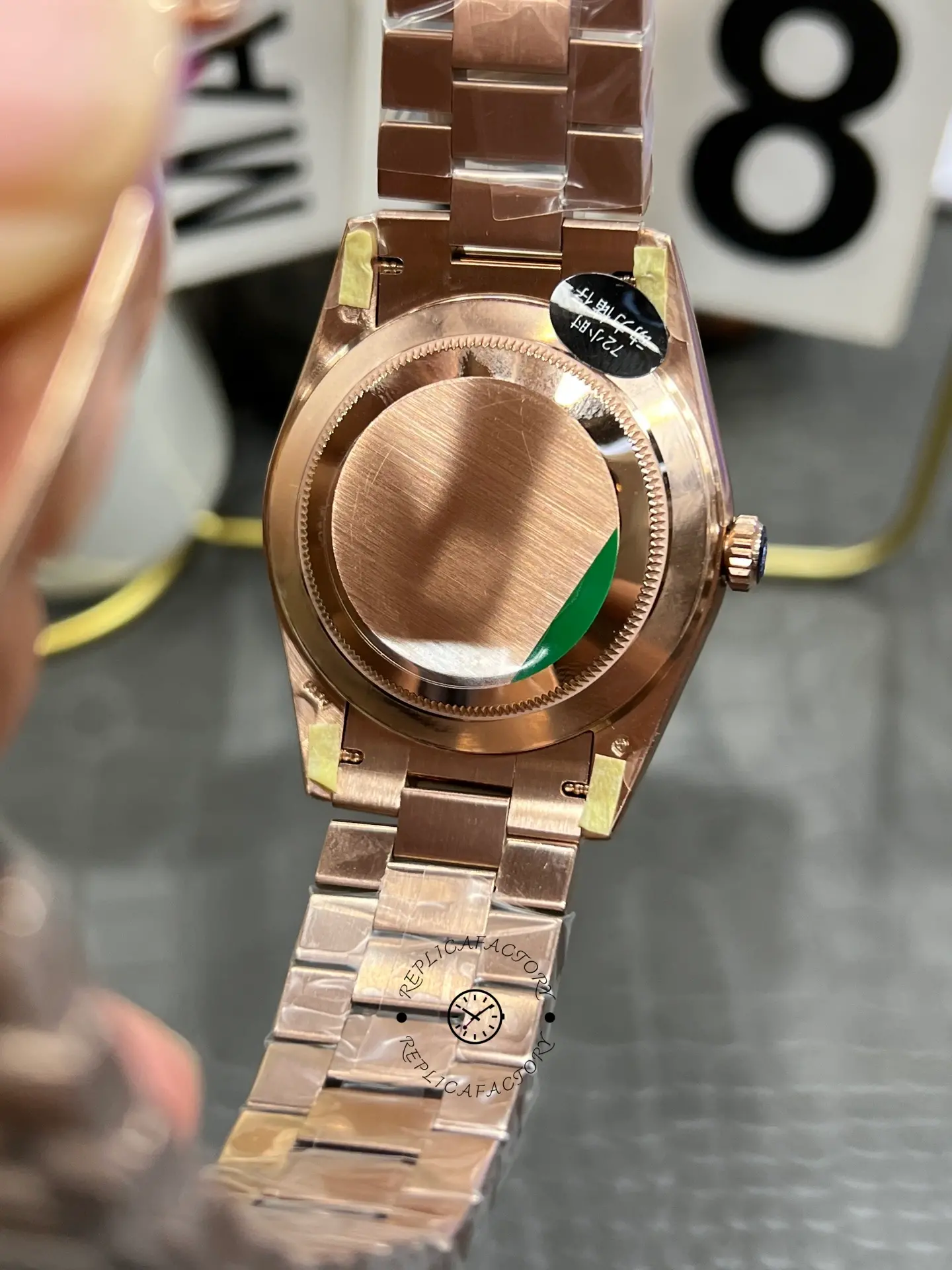 Case back view of Rolex Day-Date 40 M228235-0055 with brushed back cover and Everose gold-style bracelet.