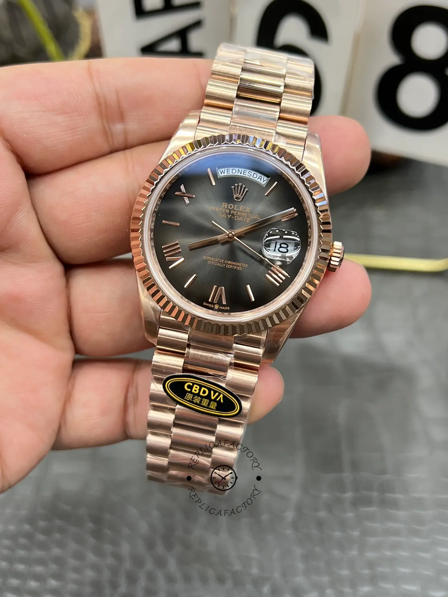 Close angled view of Rolex Day-Date 40 M228235-0055 highlighting the Roman markers and date lens at 3 o'clock.