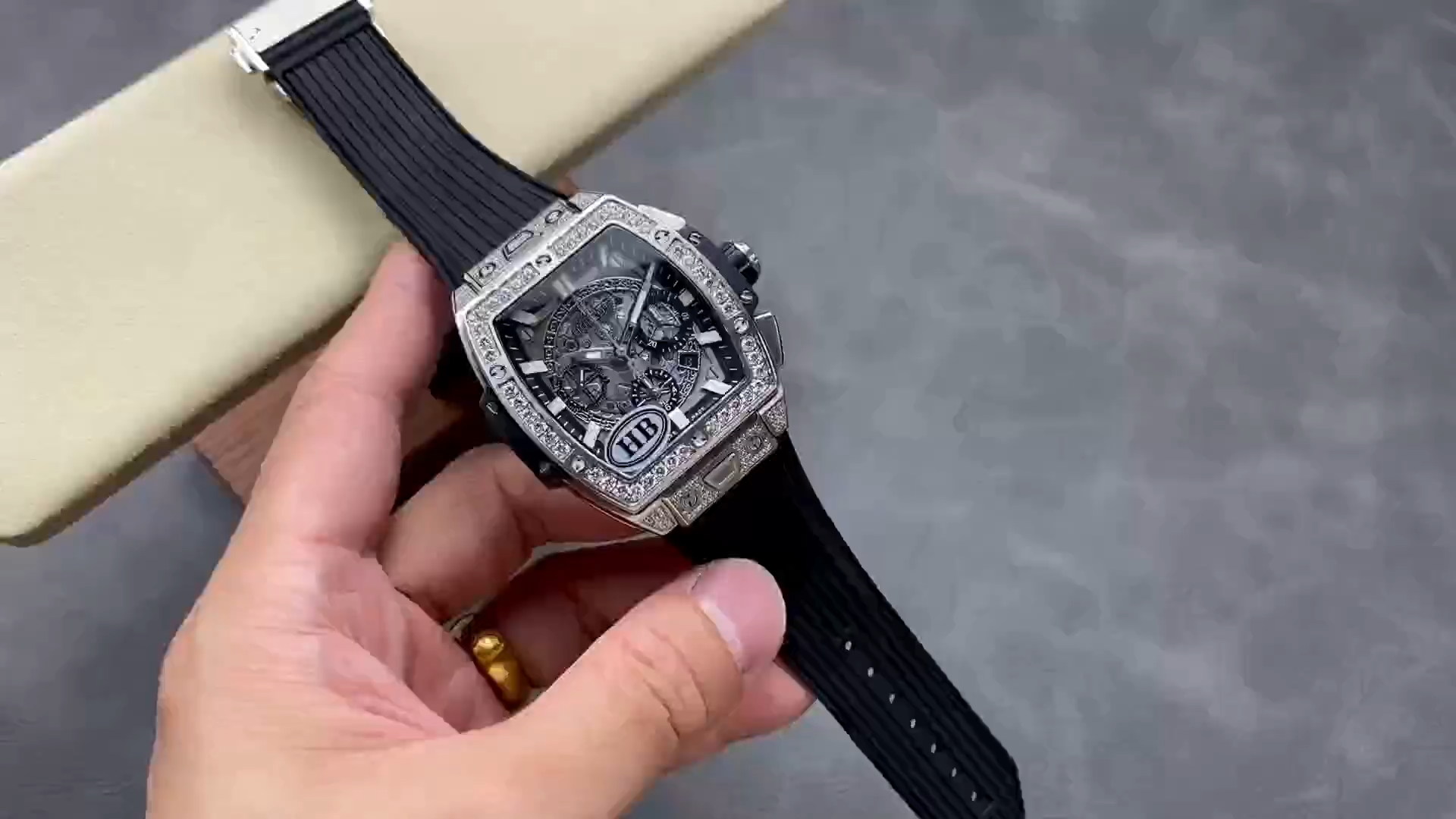 Strap in hand: Hublot Spirit of Big Bang 642.NX.0170.RX.1704 showing black rubber strap laid out. - Video