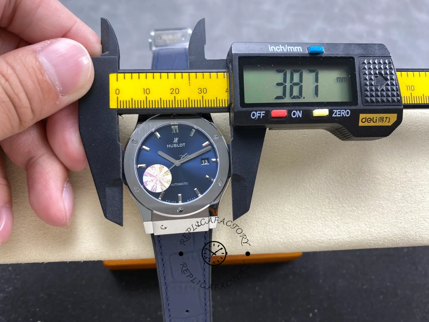 Caliper measurement close-up of Hublot Classic Fusion 542.NX.7170.LR showing diameter reading on dial view.