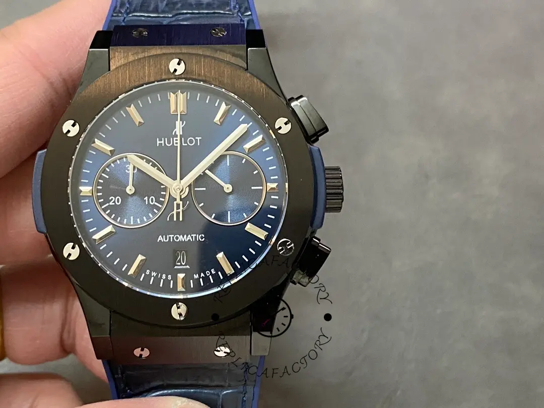 Close-up of Hublot 521.CM.7170.LR blue chronograph dial with two subdials and date window at 6 o'clock.