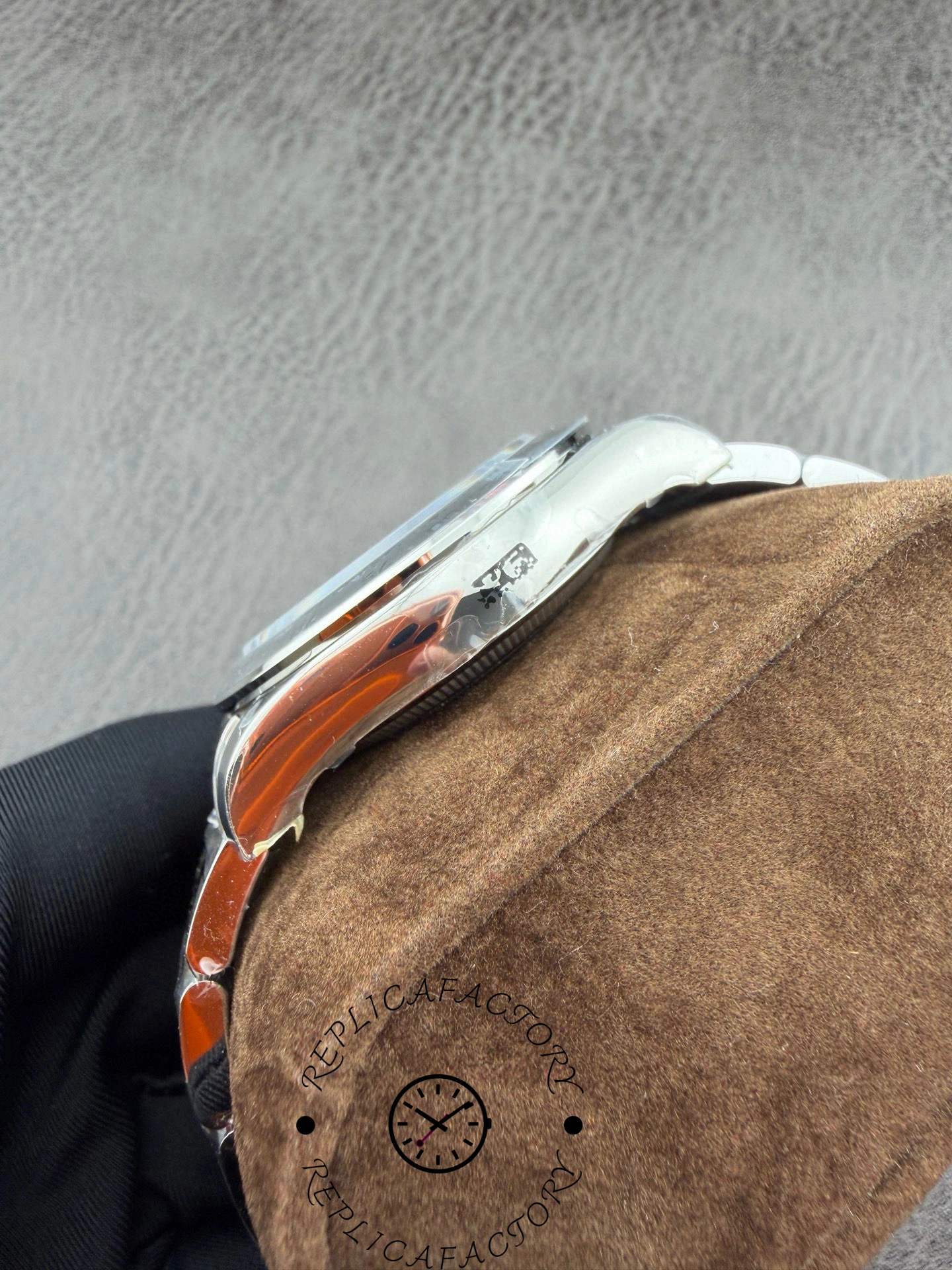 Polished case side of VS Daytona replica showing curvature and finishing quality