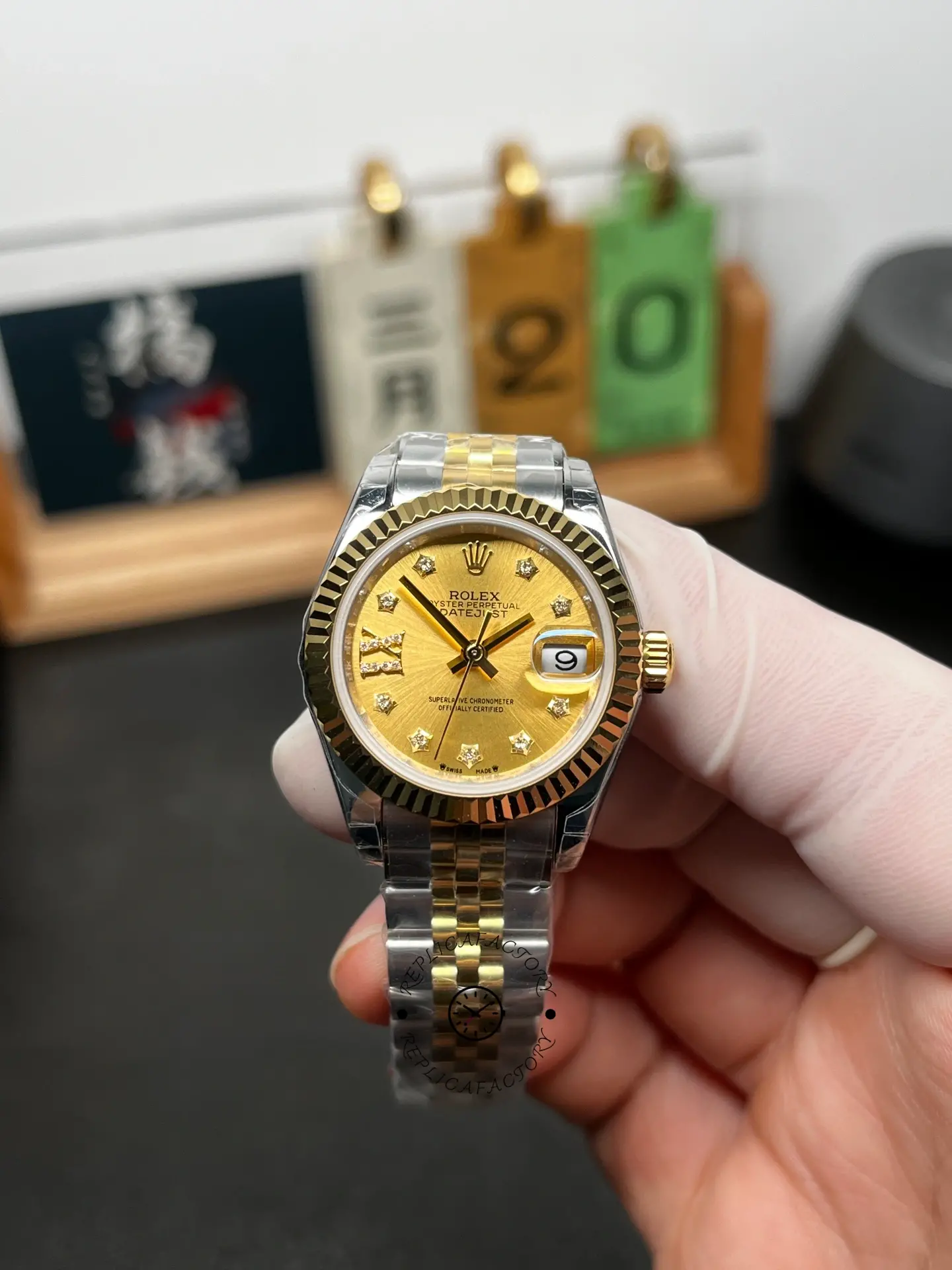 Front view of Rolex Lady-Datejust 279173-0021 with champagne dial, diamond-set markers, fluted bezel, and date window.