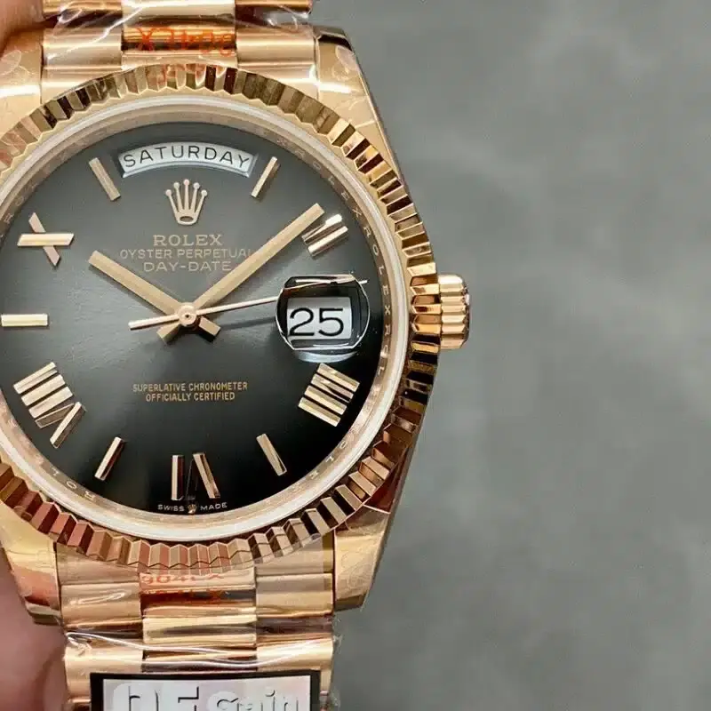 Straight-on dial view of Rolex Day-Date 40 M228235-0055 with dark dial, Roman markers, and day-date display.