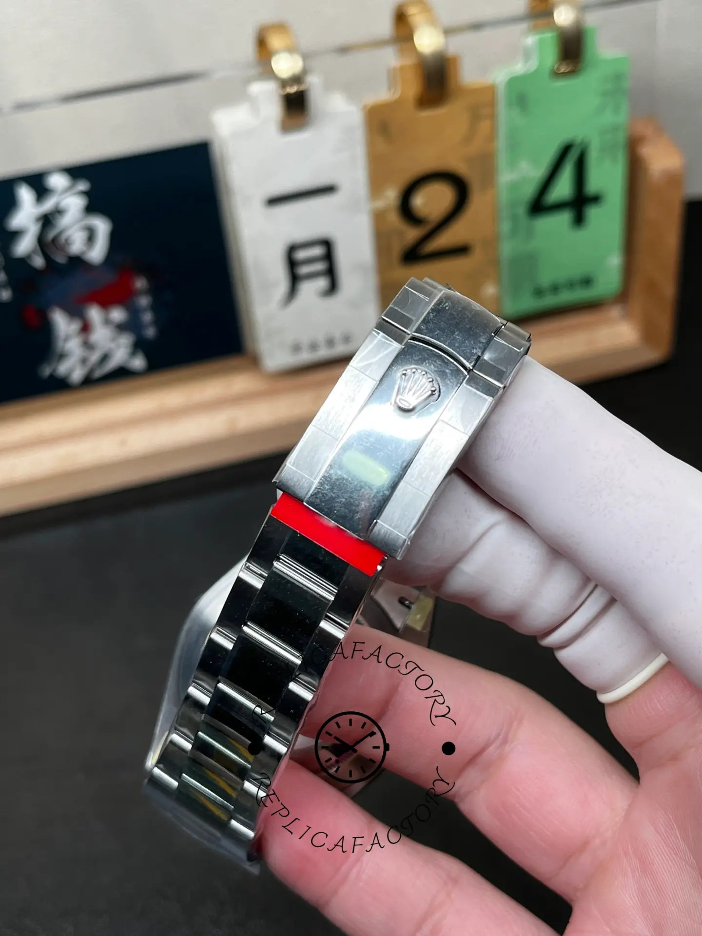 Handheld bracelet view of Rolex Datejust M126334-0013 showing the Oyster links and clasp area.