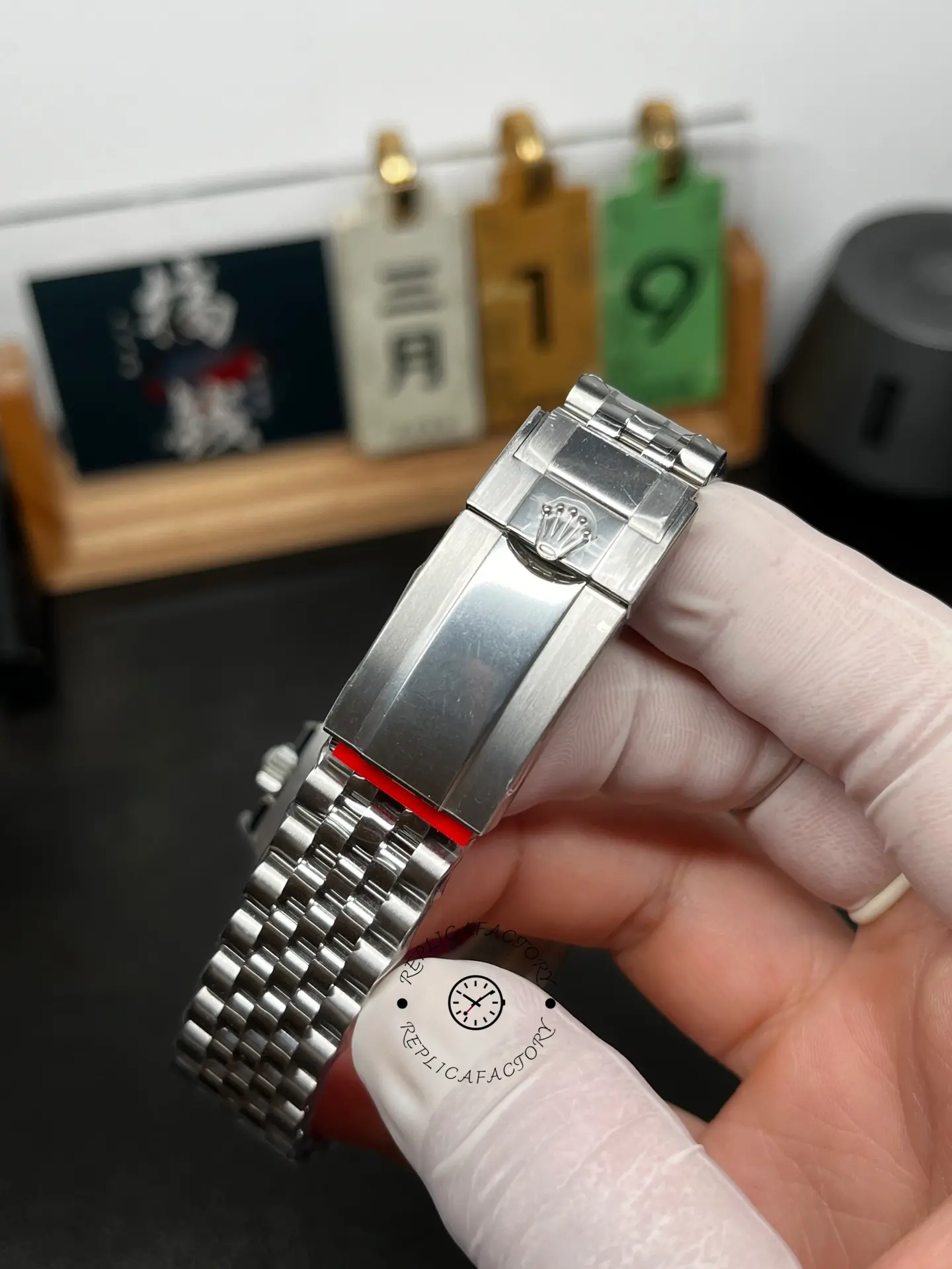 Clasp detail of Rolex GMT-Master II 126720VTNR showing the stainless steel Jubilee bracelet and Rolex logo.