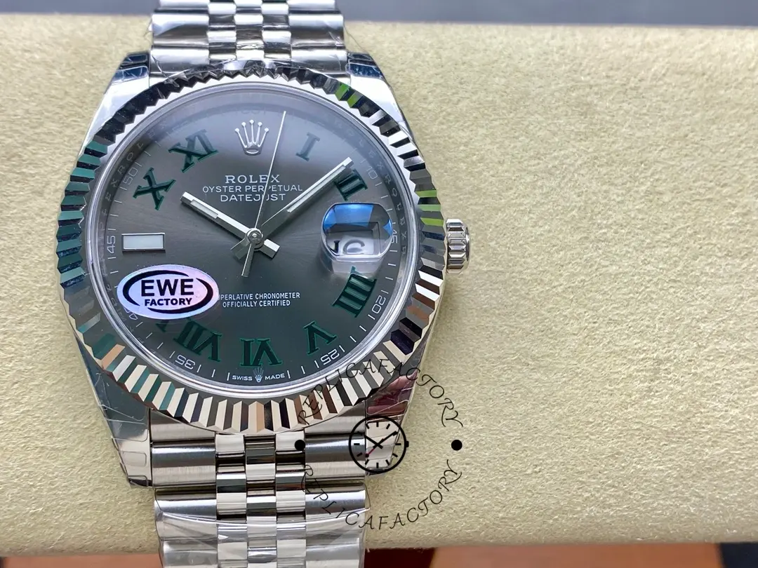 Front view of Rolex Datejust 126334-0022 on a display cushion with slate grey Roman dial and fluted bezel.