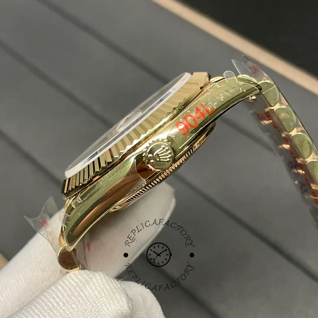 Side view of Rolex Day-Date 228238 showing fluted bezel, gold crown and polished yellow gold-tone case.