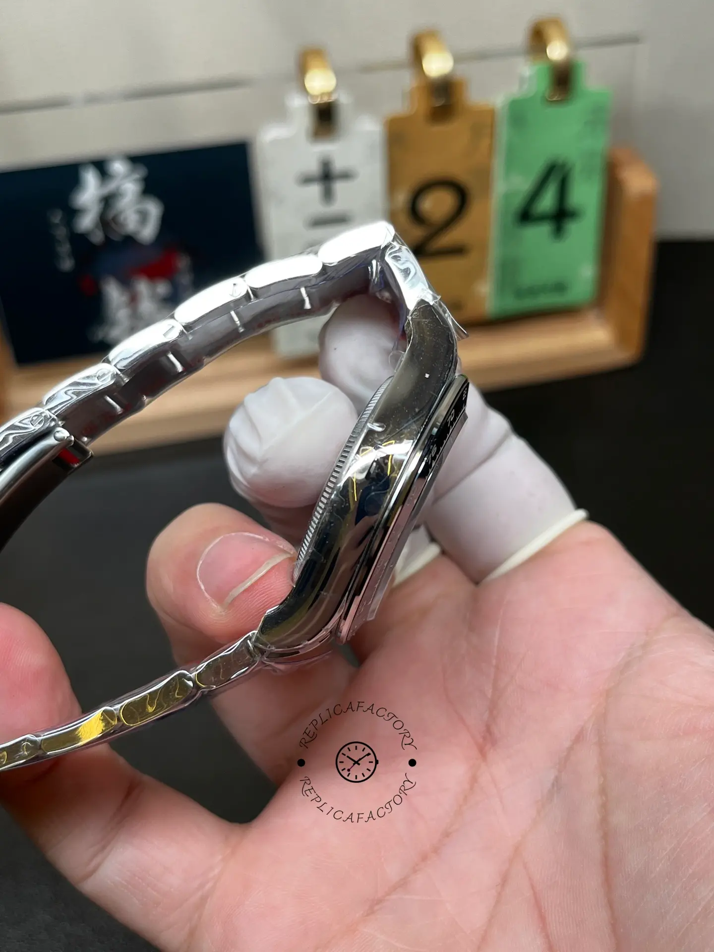 Opposite side profile of Rolex Cosmograph Daytona M126500LN-0001 showing the case side and bezel edge.
