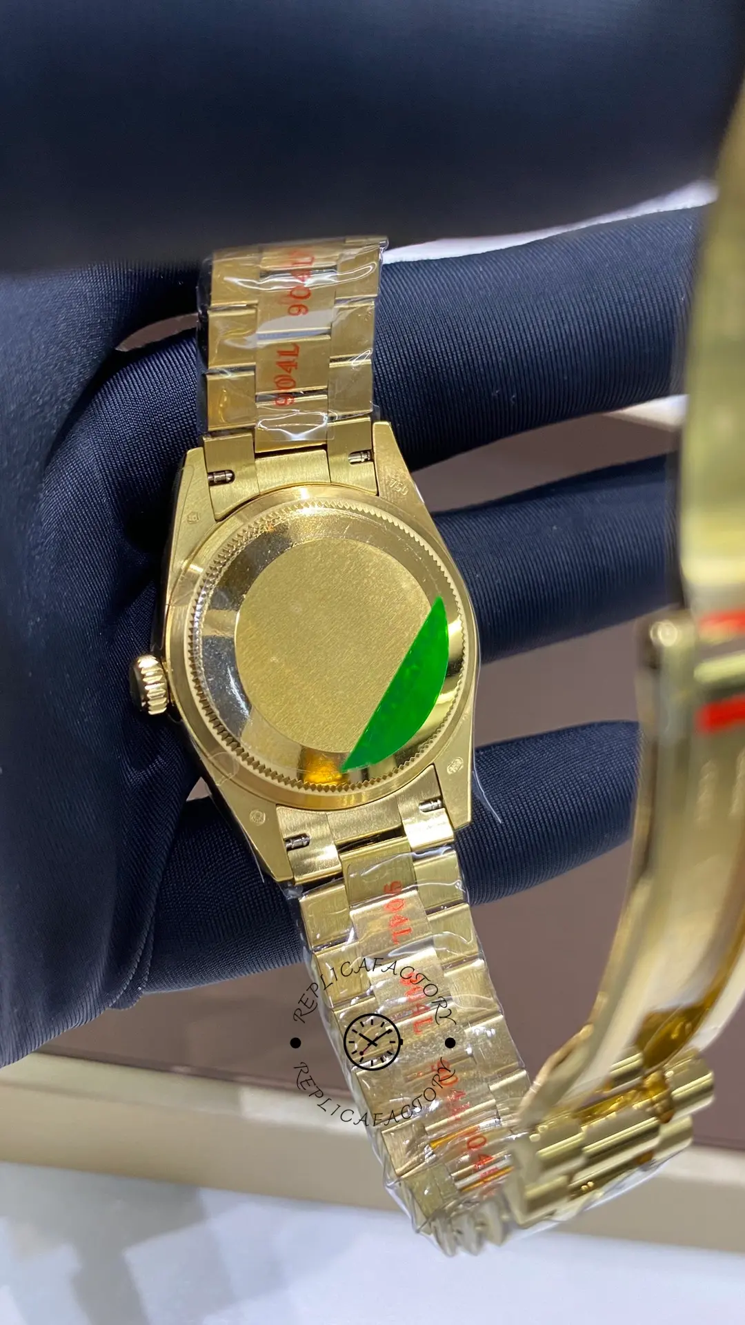 Case back view of Rolex Datejust 278278-0049 with solid back and gold-tone President bracelet.