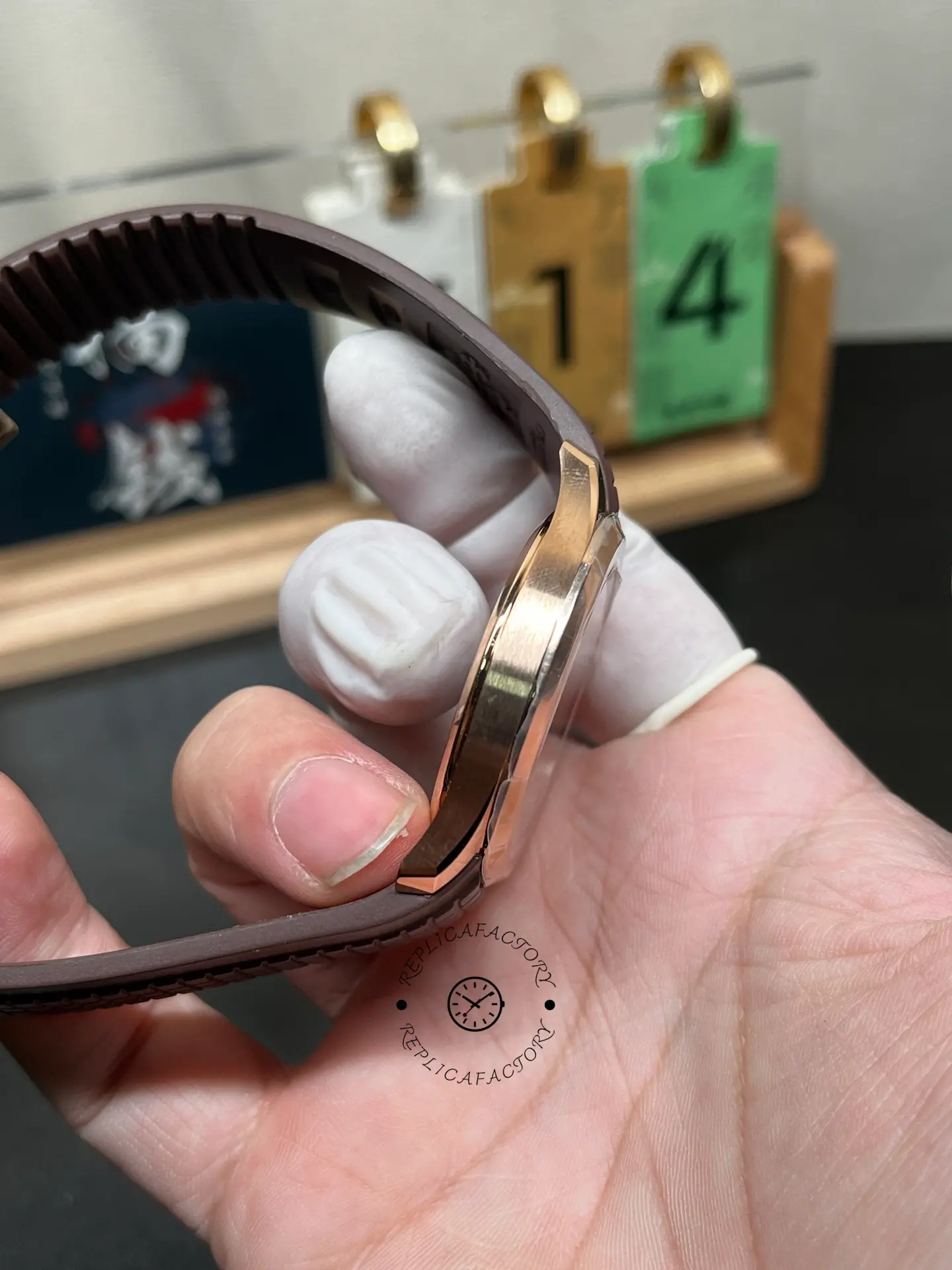 Patek Philippe Aquanaut 5167R-001 side profile, slim rose-gold case and brown strap fit.